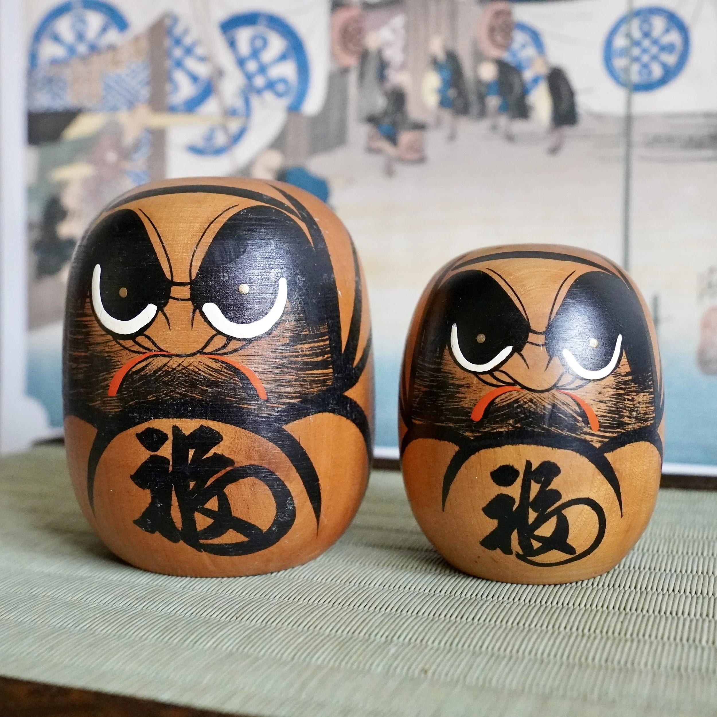 Vintage hand painted wooden daruma pair, large and small figure, Japanese Showa period folk craft.