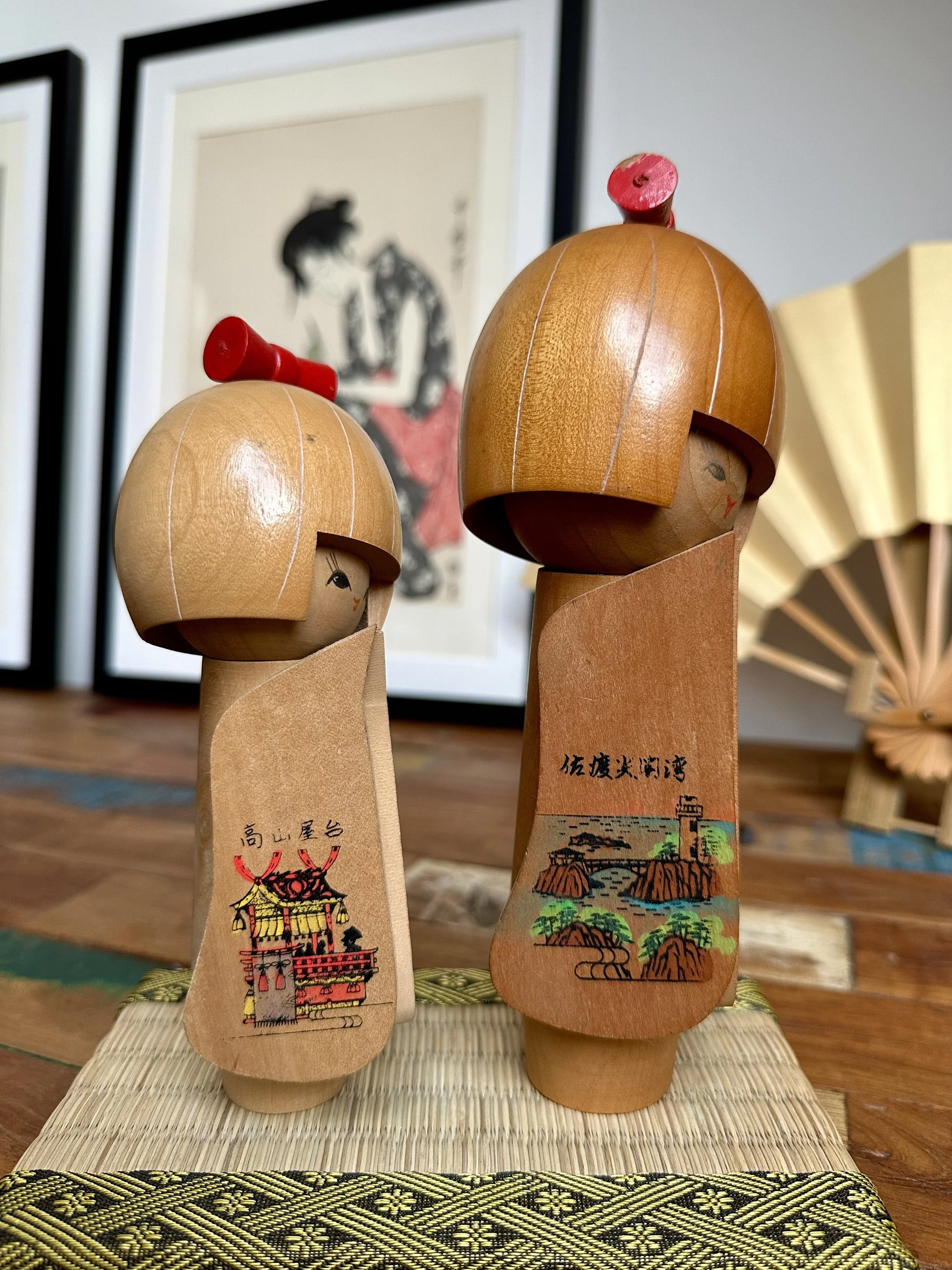 Sado Island panel kokeshi Senkaku Bay cliffs Okesa dancer three-quarter angle ukiyo-e print backdrop