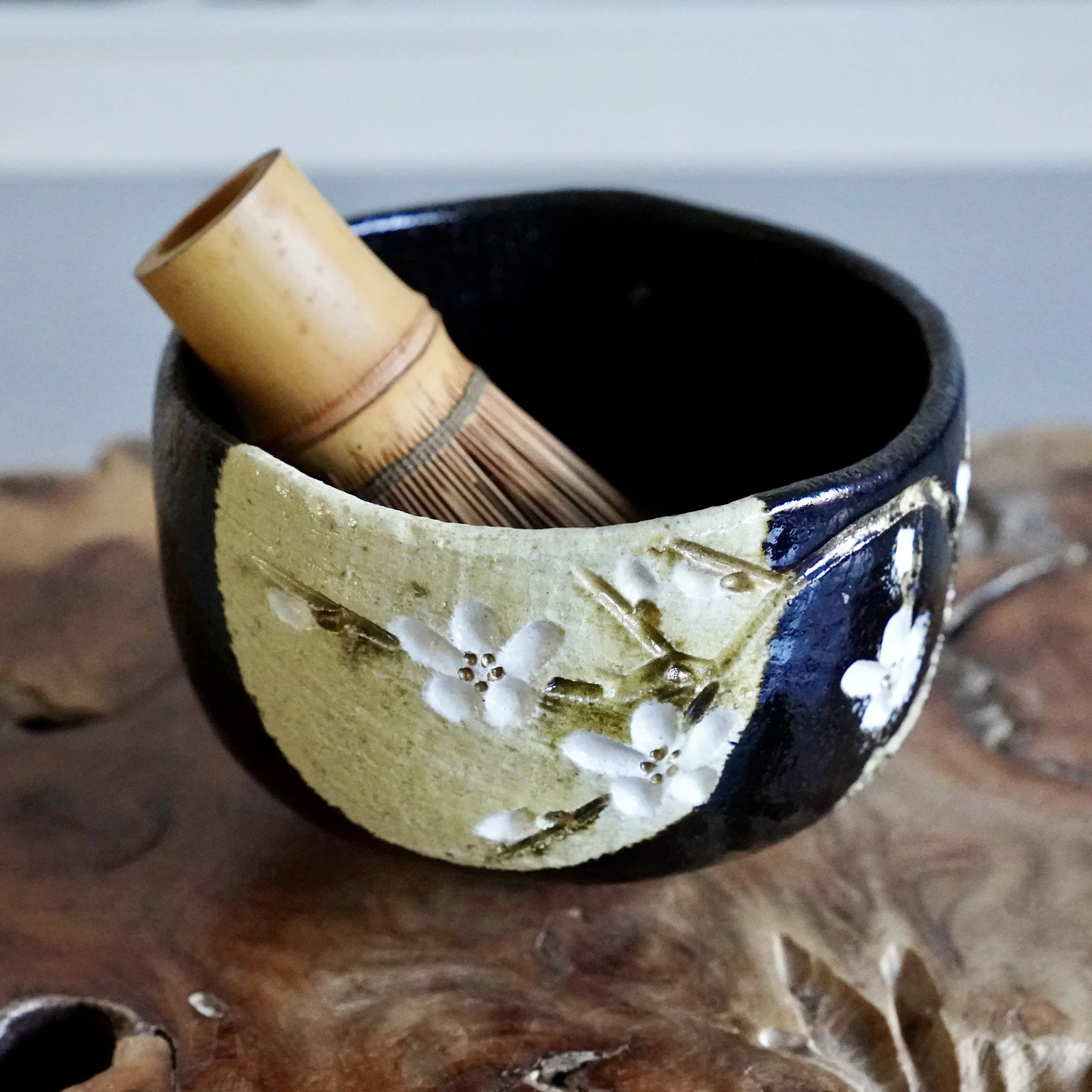 Black glazed chawan by Okugawa Katsuomi with bamboo chasen whisk