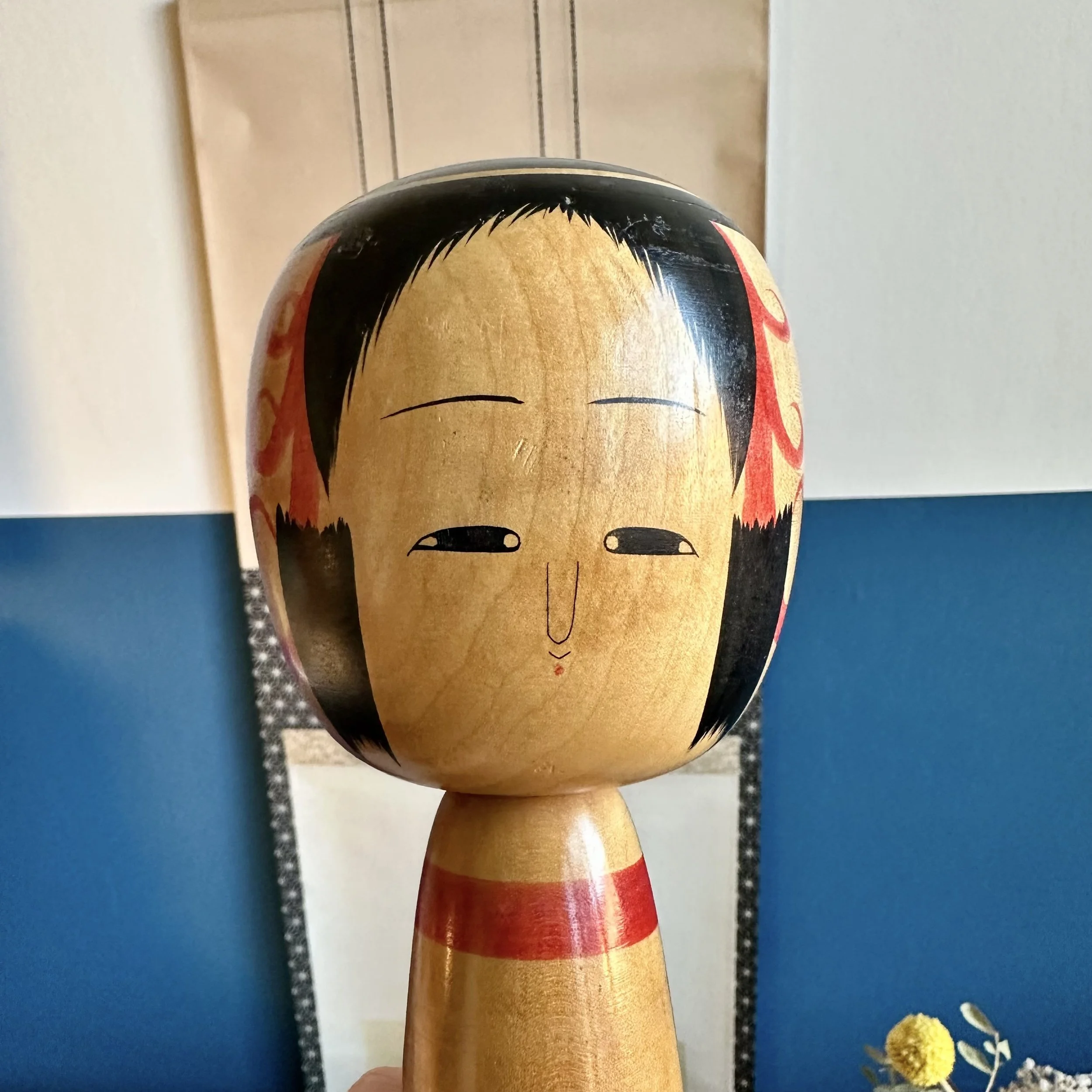 Abe Kazue signed Tsuchiyu kokeshi, hand painted face with red side motifs