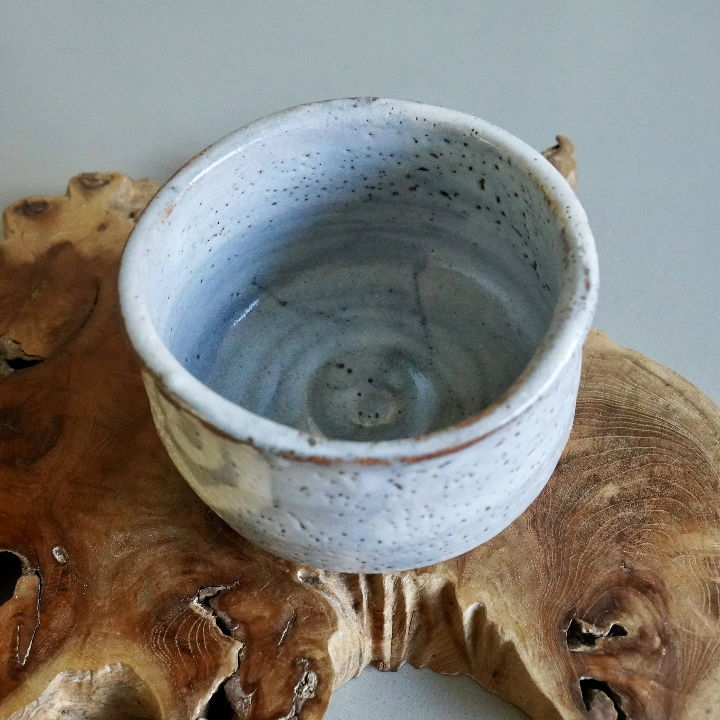 Shino chawan interior, pale blue grey glaze, visible throwing rings