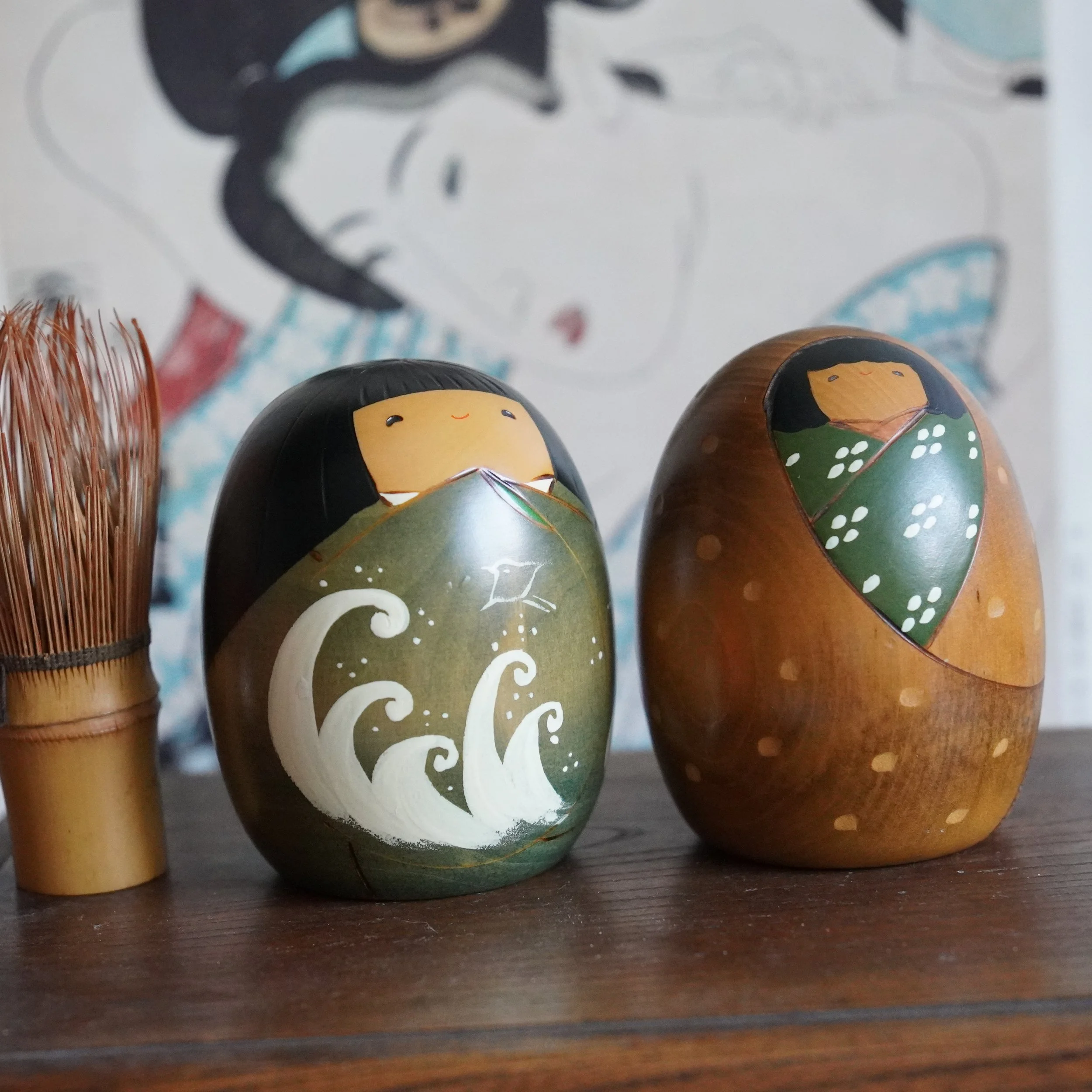 Vintage Usaburo kokeshi pair styled with bamboo tea whisk, Shiki no Uta four seasons series, Showa period Japan