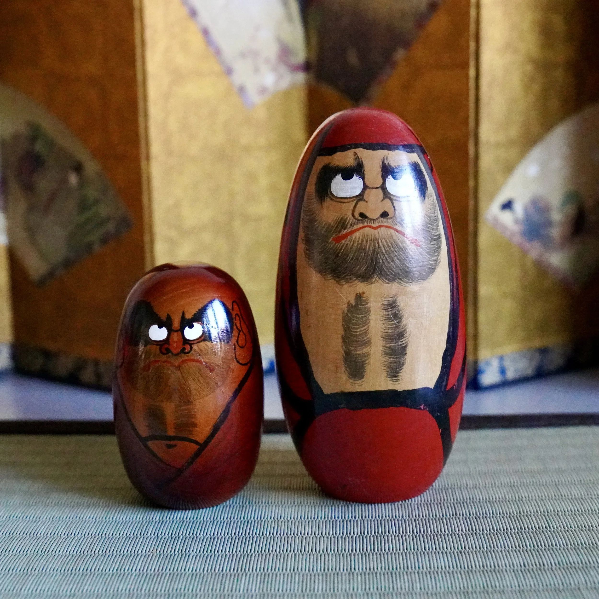 Vintage daruma pair by Shido Shozan and Seifu Gono, Shōwa period, vermilion and oxblood