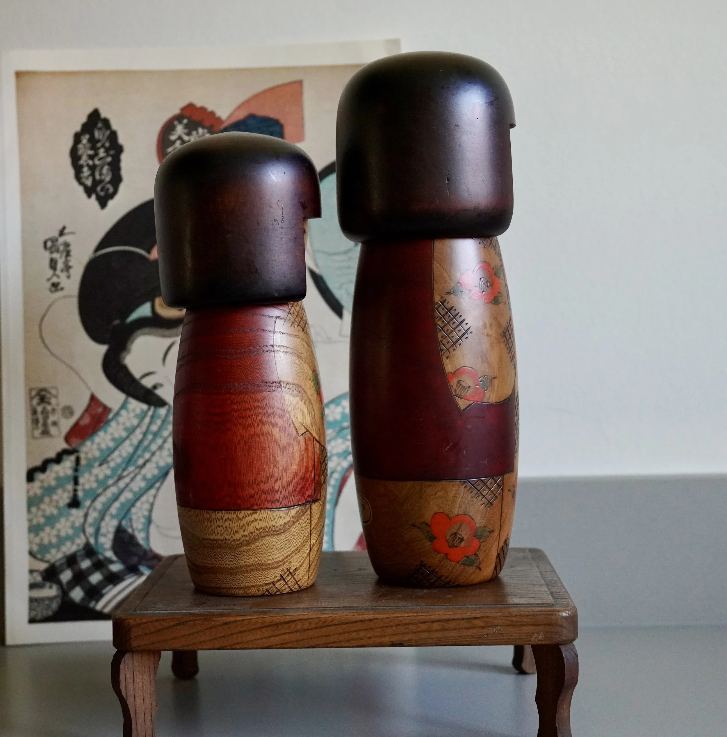 Usaburo sosaku kokeshi pair behind view studio seal zelkova Showa