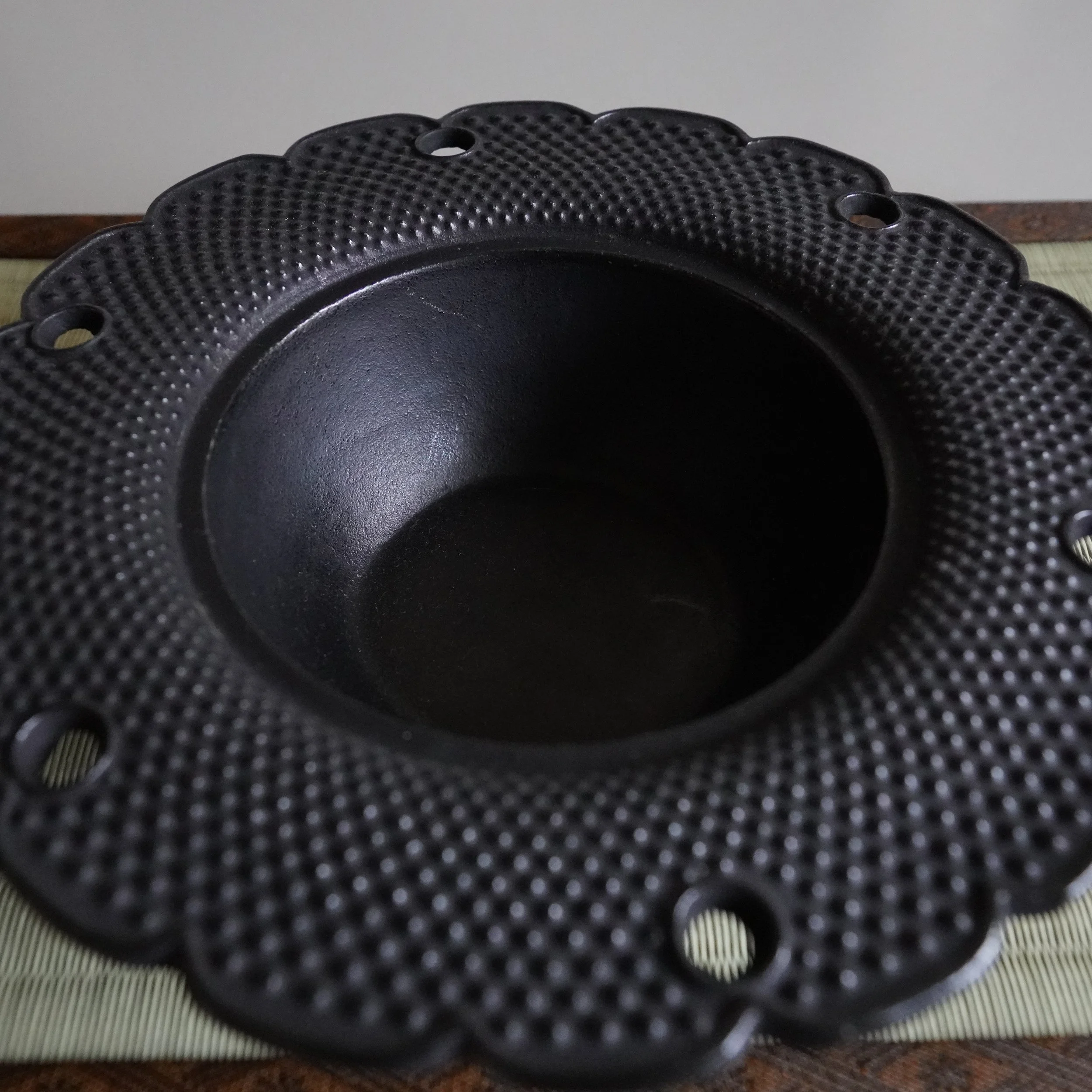 Nanbu Tekki cast iron kōro with the sakura lid removed, showing the bowl interior for holding incense ash