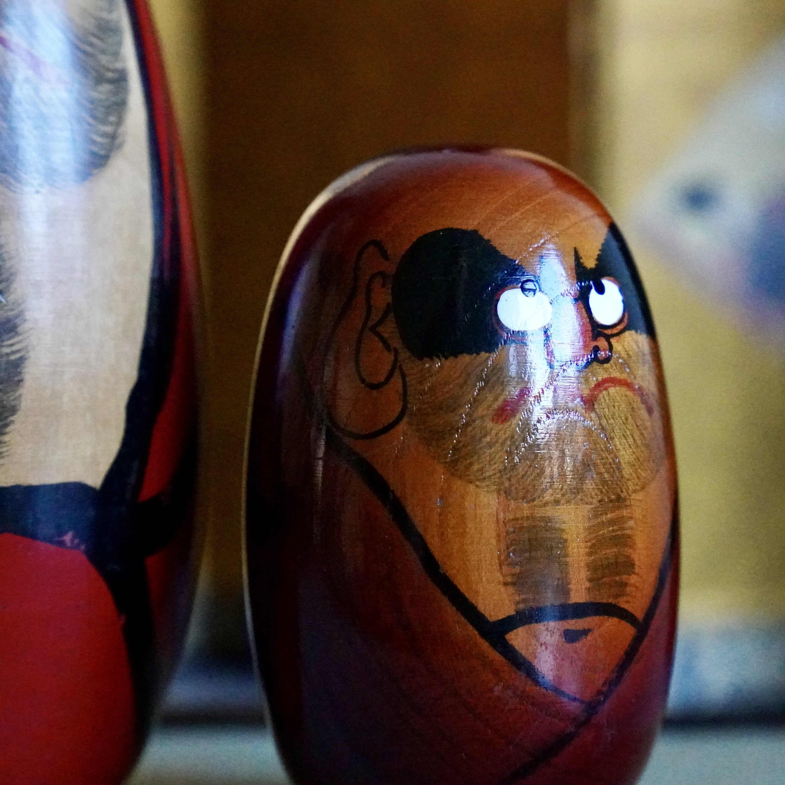 Vintage daruma side profile attributed to Seifu Gono, Shōwa period, oxblood wood