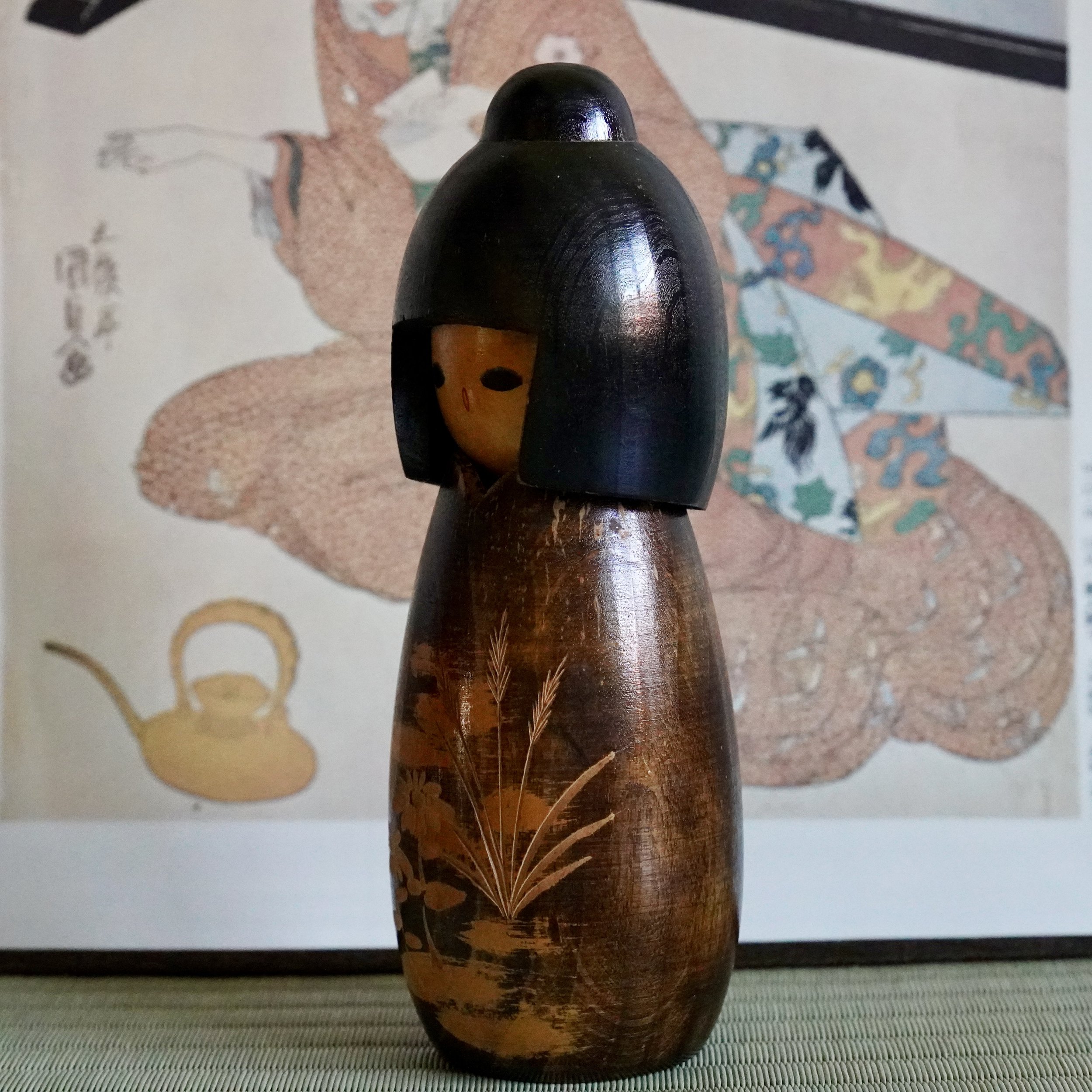 Kokeshi side profile, carved hair detail, sōsaku style