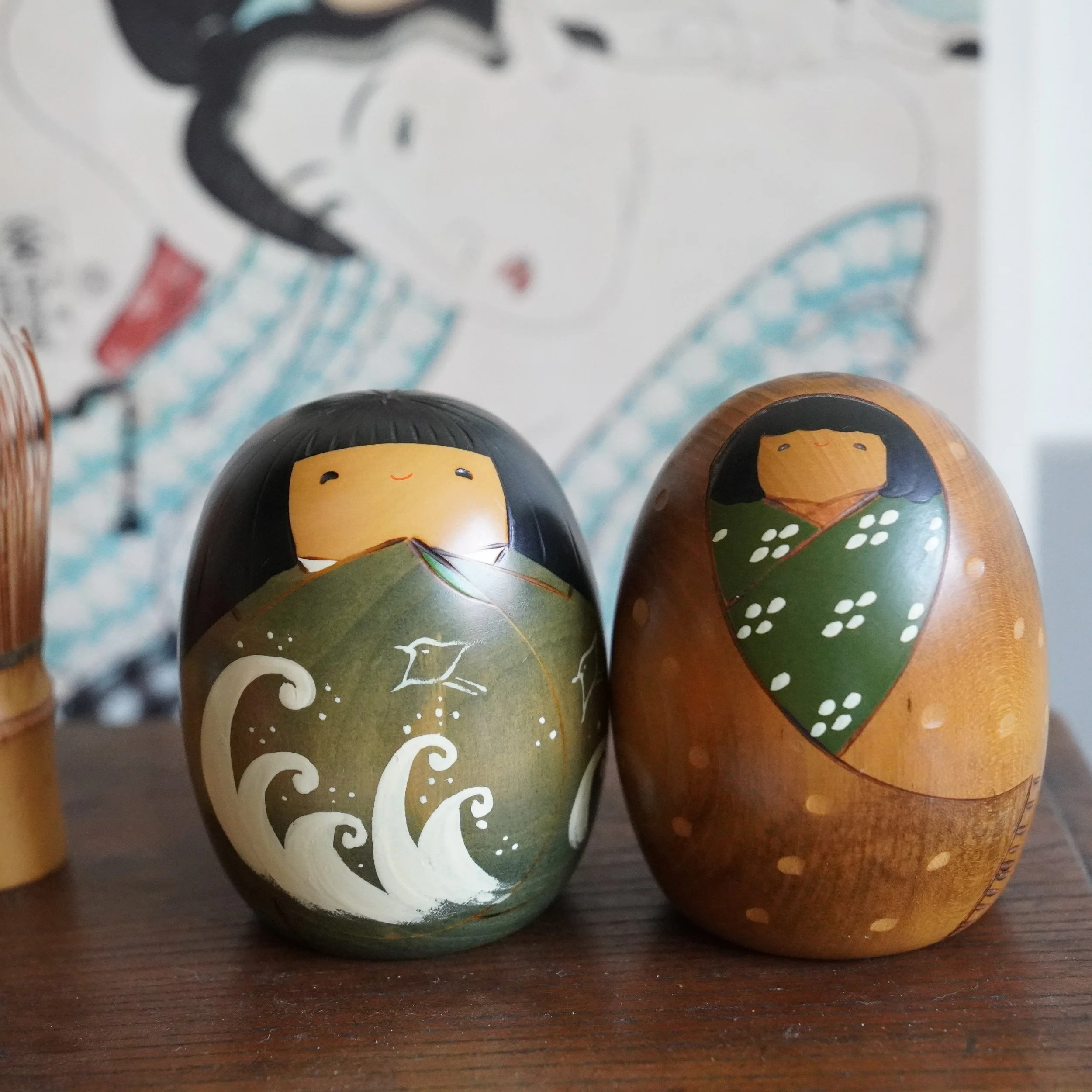 Vintage Usaburo kokeshi pair, summer wave motif and winter snow motif, Shiki no Uta four seasons series, Showa period