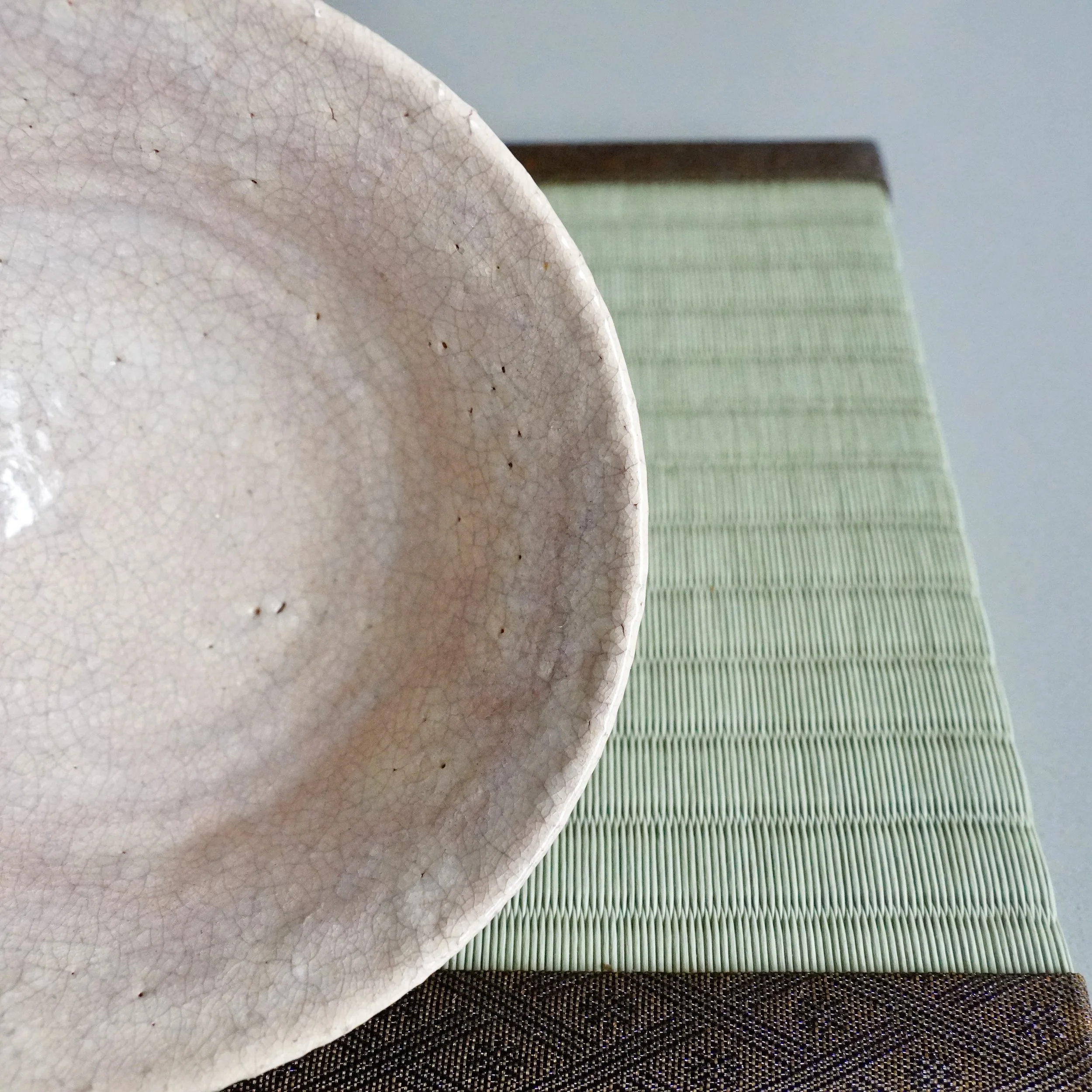 Top view of Hagi-yaki chawan interior, fine kan'nyū crackle glaze with warm karahai pink tone
