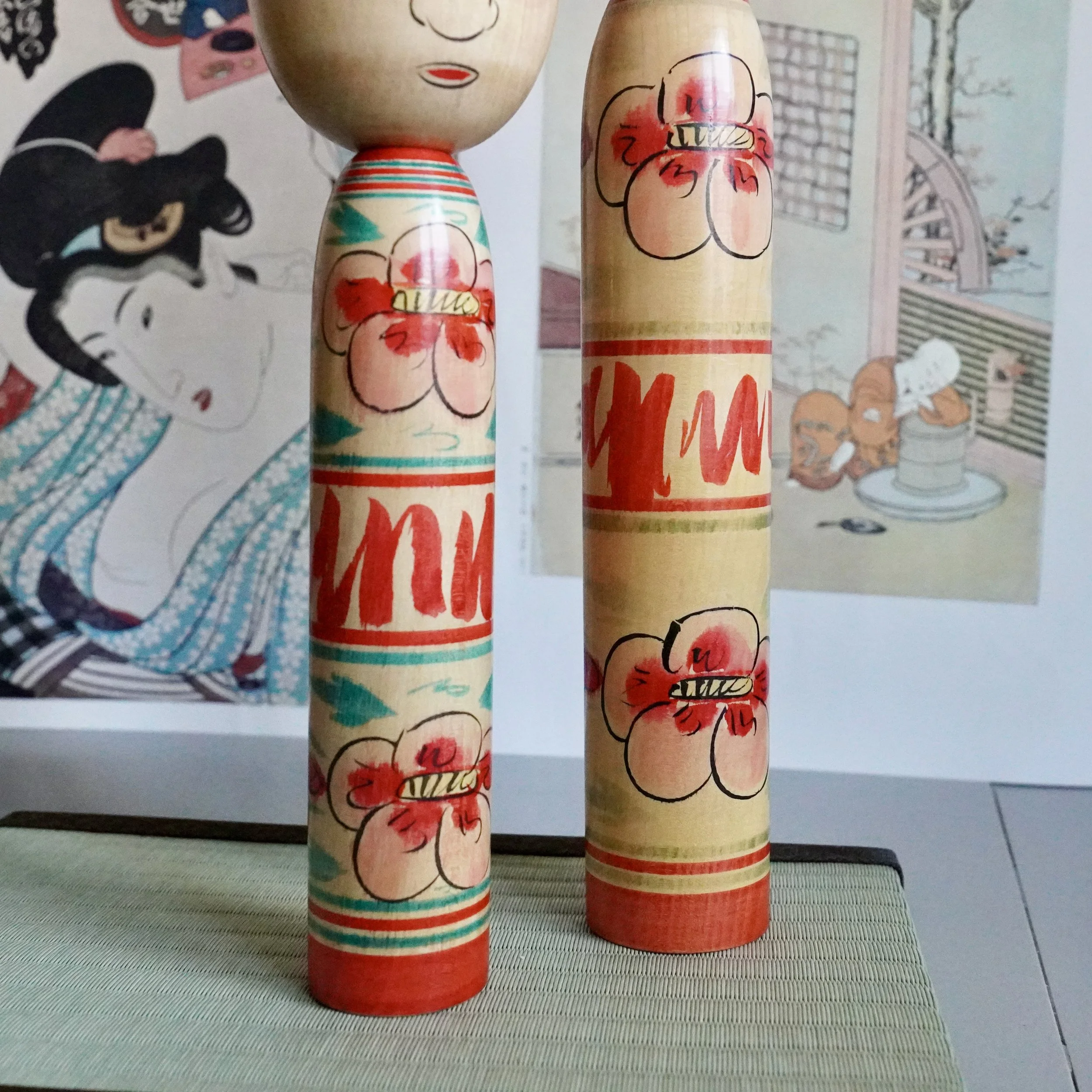 Nakanosawa Takobozu kokeshi pair standing on tatami mat, full figure view, signed vintage kokeshi by Saito Tokuju