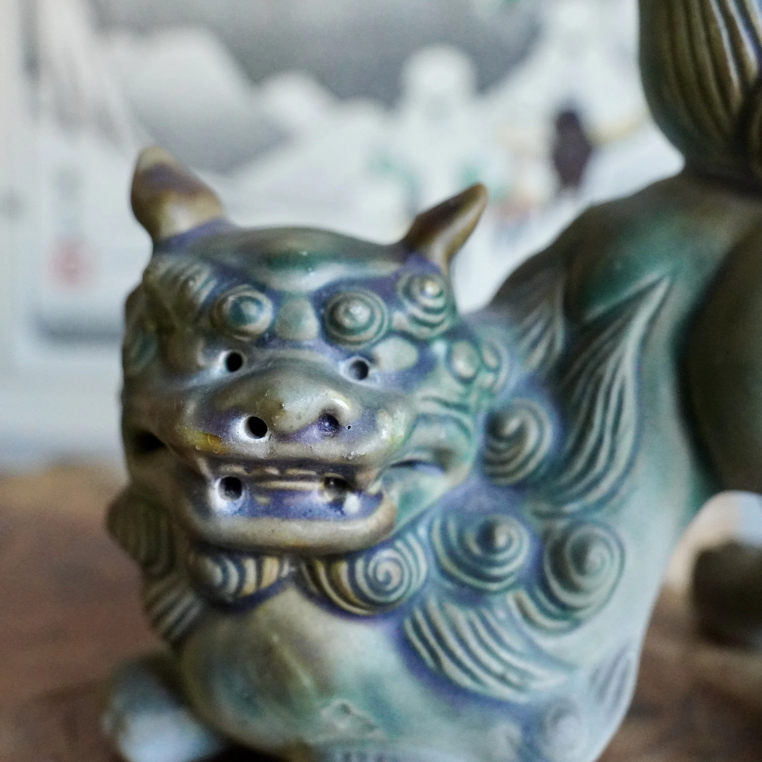 Close-up of a vintage Kutani ware foo dog, a komainu guardian lion figure with hand-painted glaze detail, Japan, 1970s