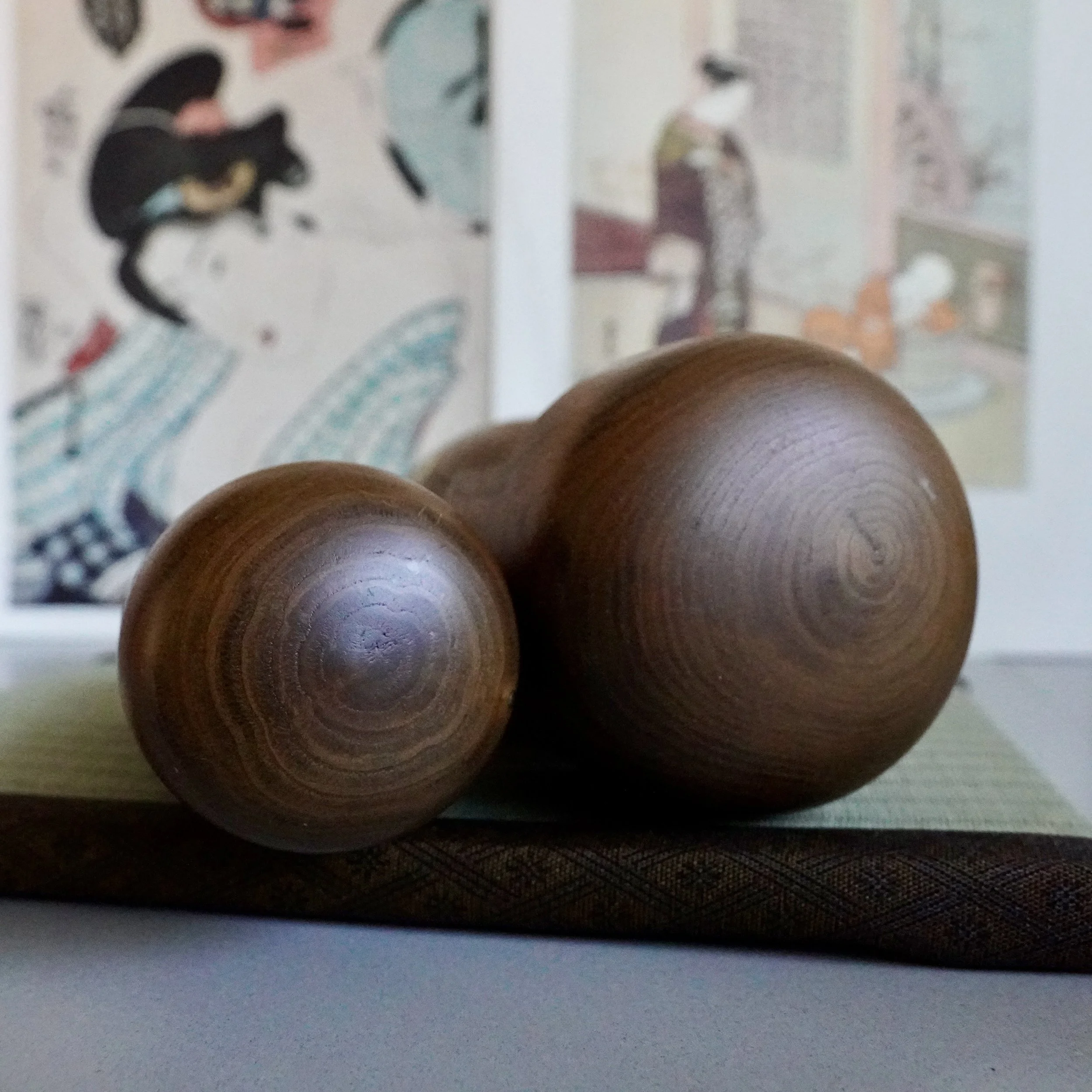 Usaburo kokeshi pair natural wood hair overhead view of heads