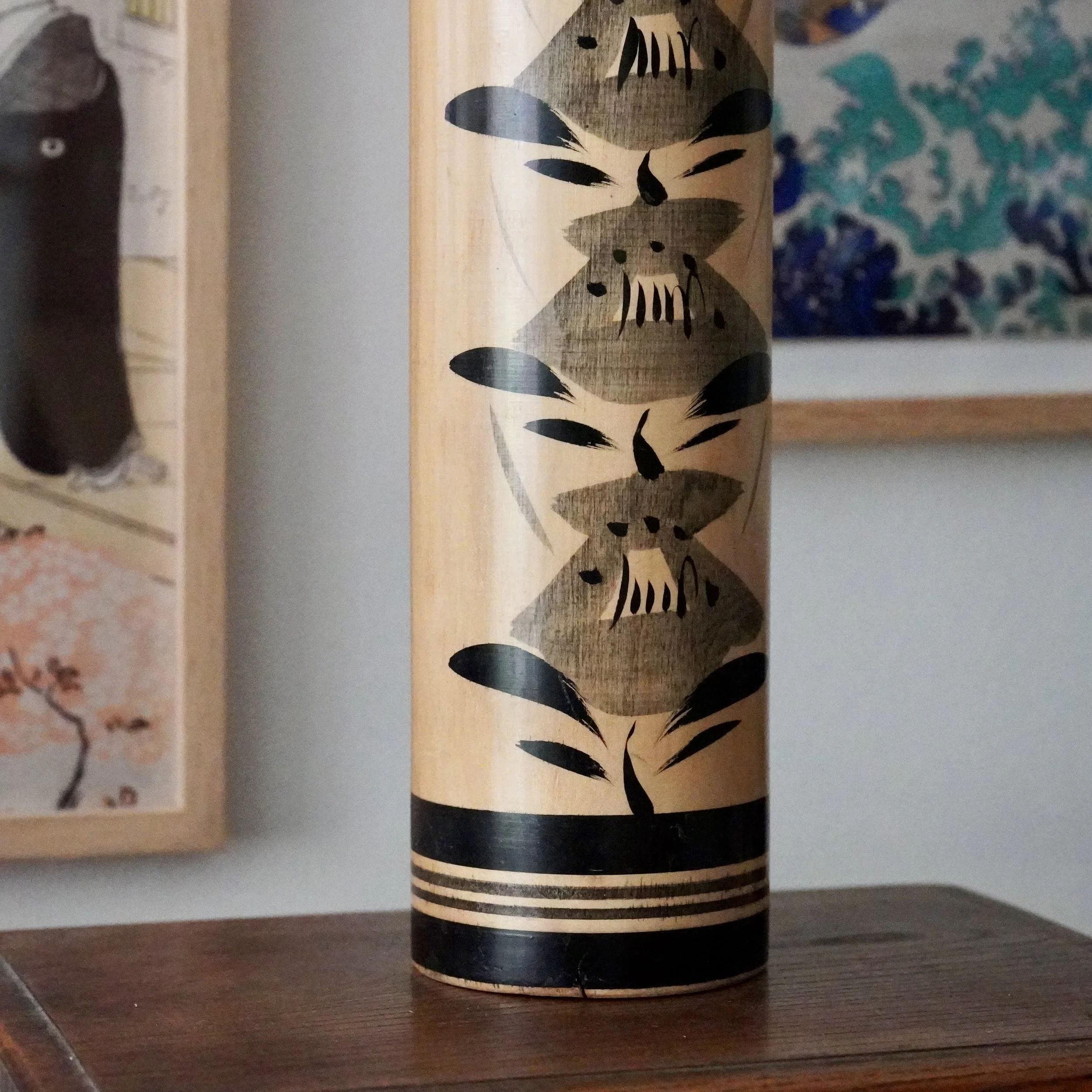 Japanese kokeshi doll lower body, stacked flower motif, black striped base band, signed tetsuen female kokeshi maker