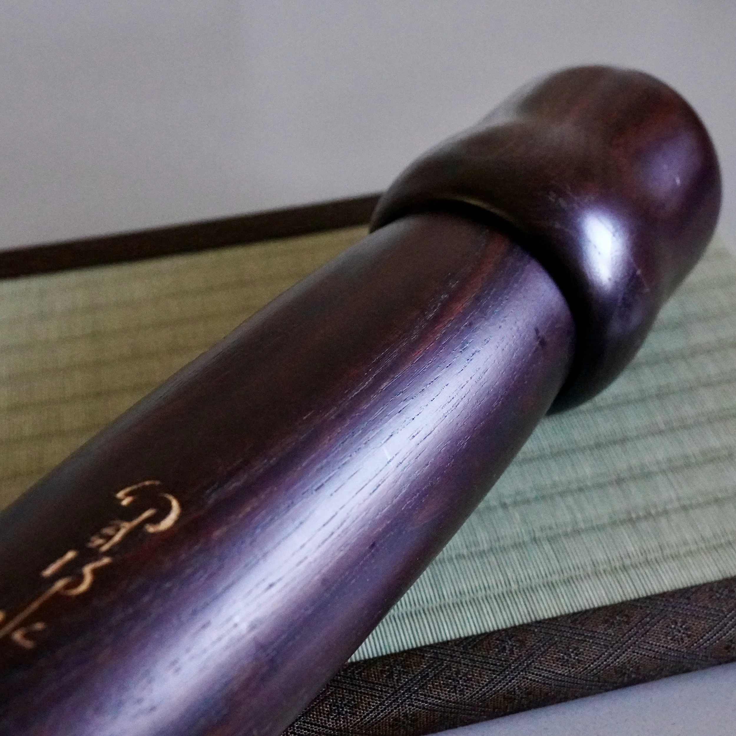 Usaburo kokeshi base, carved signature of Yuji Okamoto close up