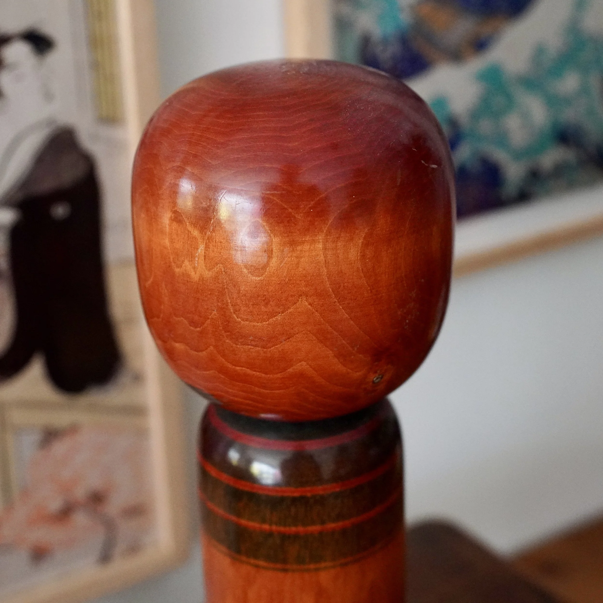 Top of kokeshi head showing natural wood grain