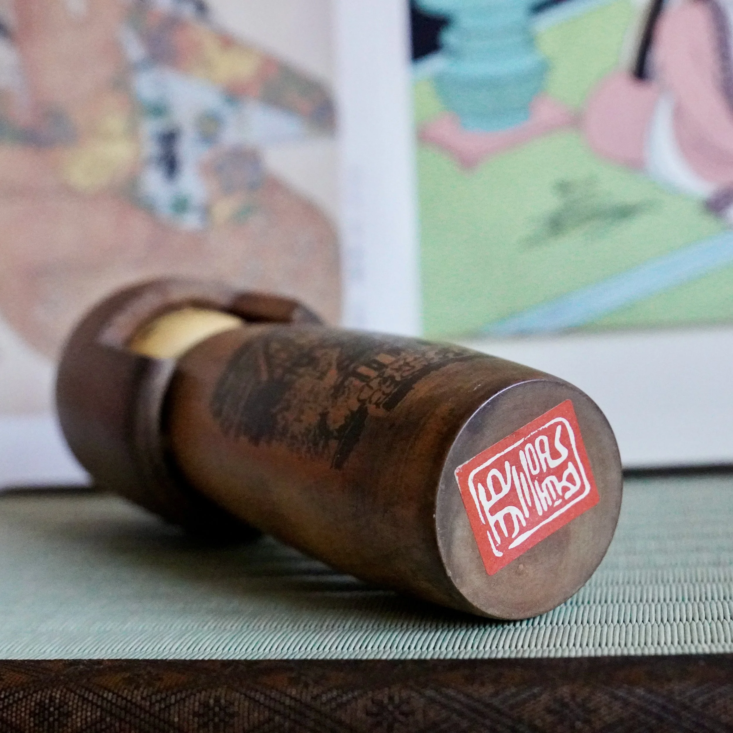 Usaburō Kokeshi workshop seal stamped on the base of a vintage kokeshi doll