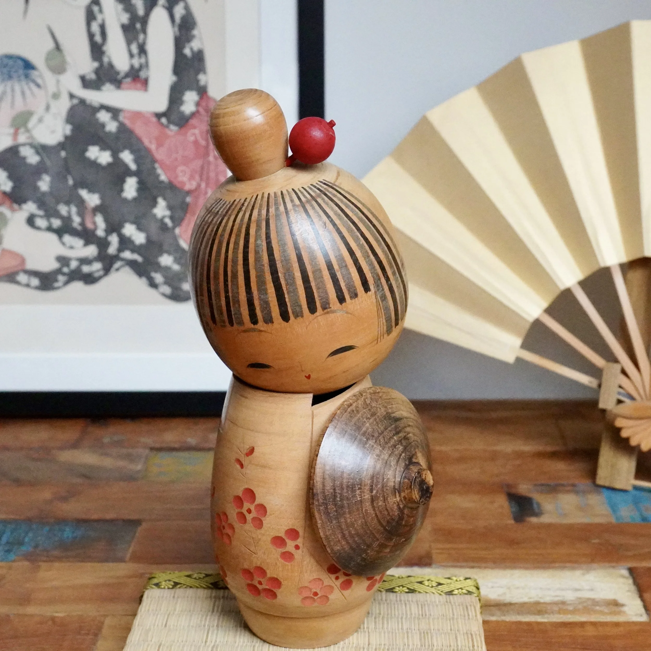 Large sōsaku kokeshi with plum blossoms, signed by Sato Suigai, Shōwa period