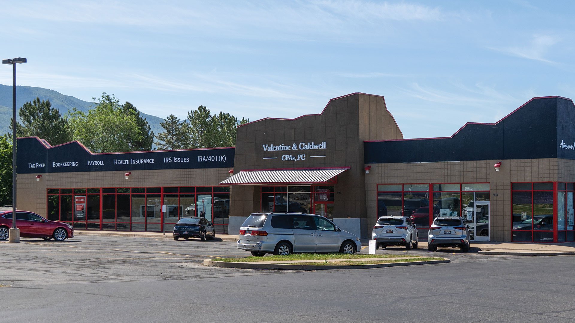 Valentine & Caldwell CPAs, PC, Layton, Utah location, featuring services like tax prep, bookkeeping, payroll, health insurance, IRS issues, and IRA/401(k). The parking lot has several cars parked, with a mountain view and trees in the background.