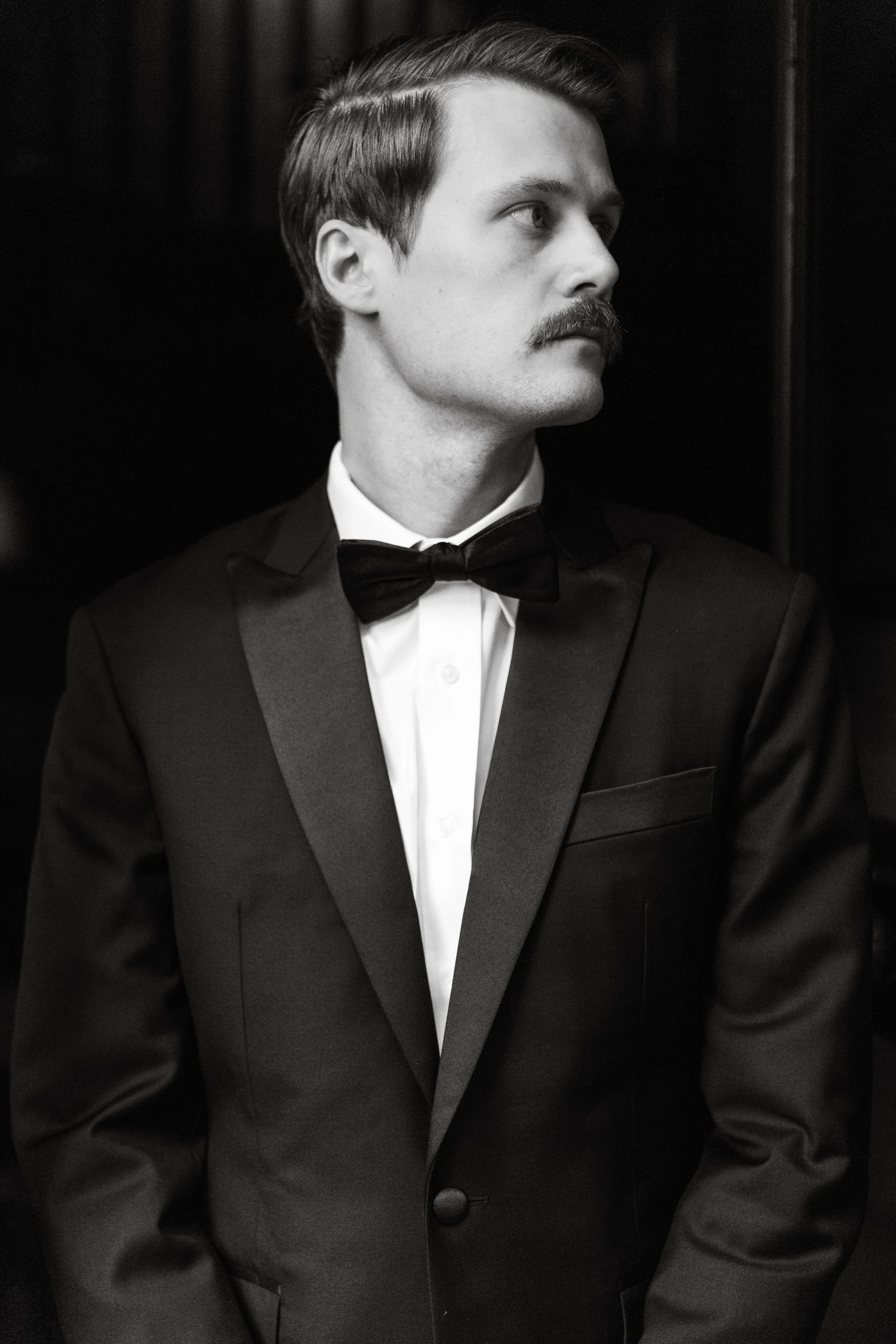 The groom in black and white portrait, wedding in Tuscany at Le Filigare wine resort.