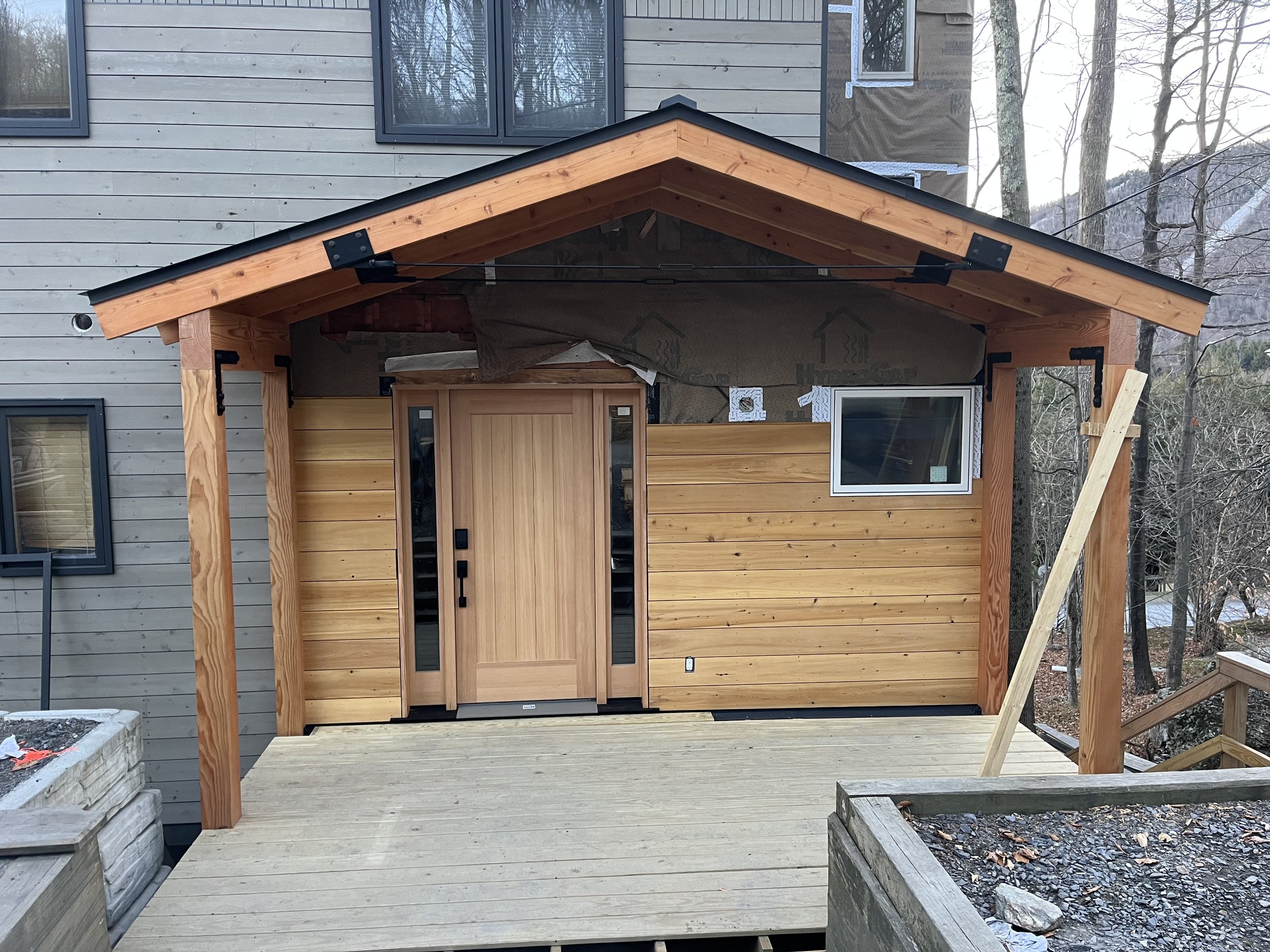 New fir entryway and standing seam roof.  Warren, VT