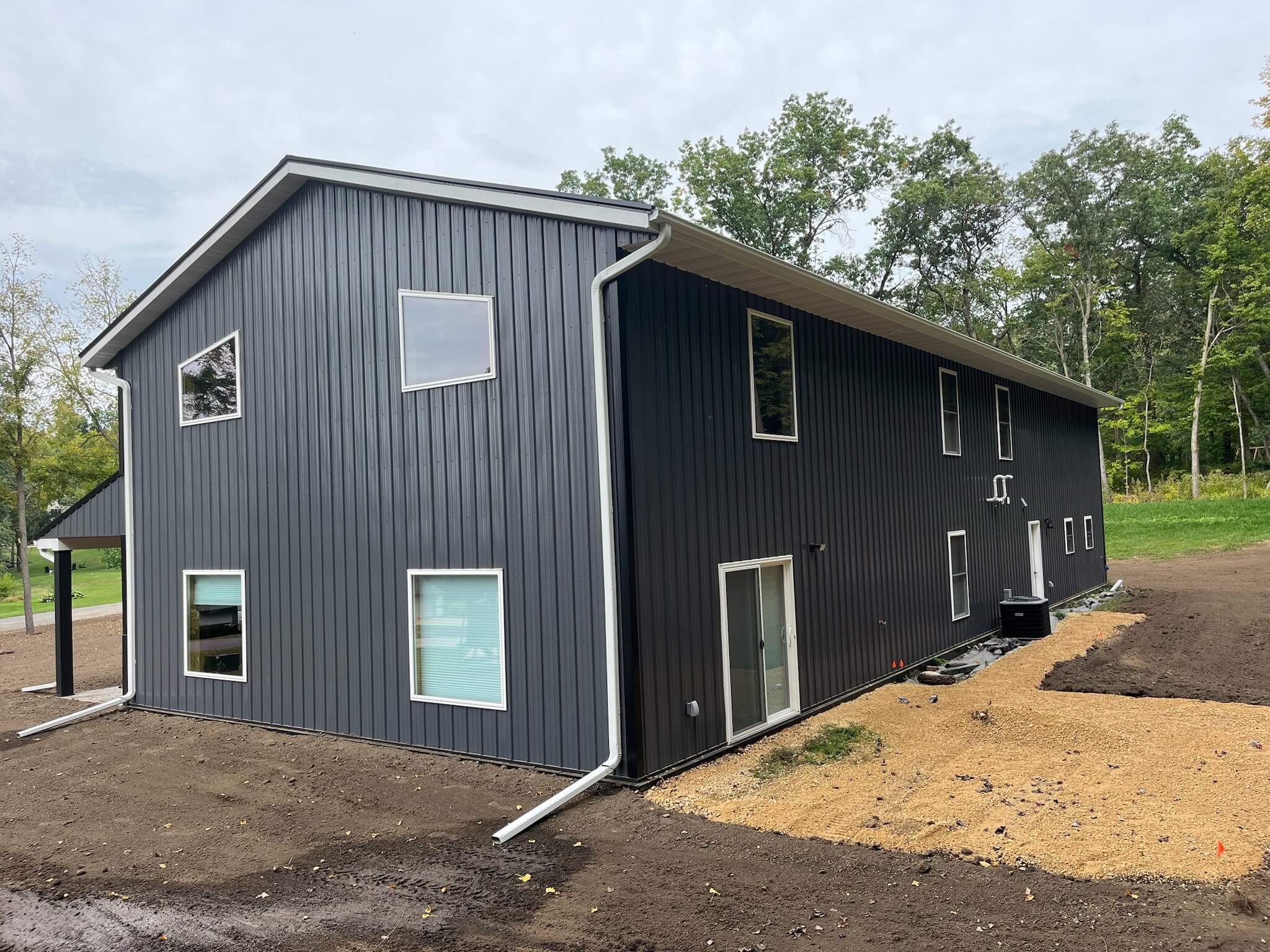 Single family home featuring new seamless gutters