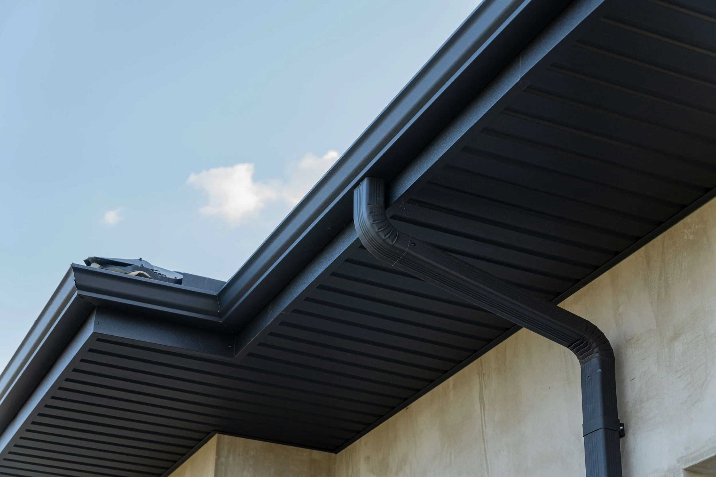 Seamless gutter installation on single family home