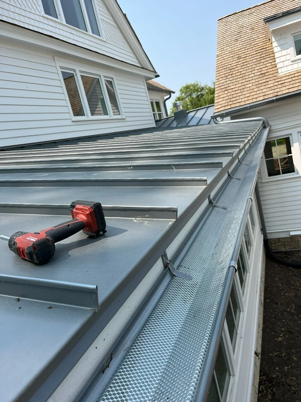 Leaf guard installed on seamless residential gutters.