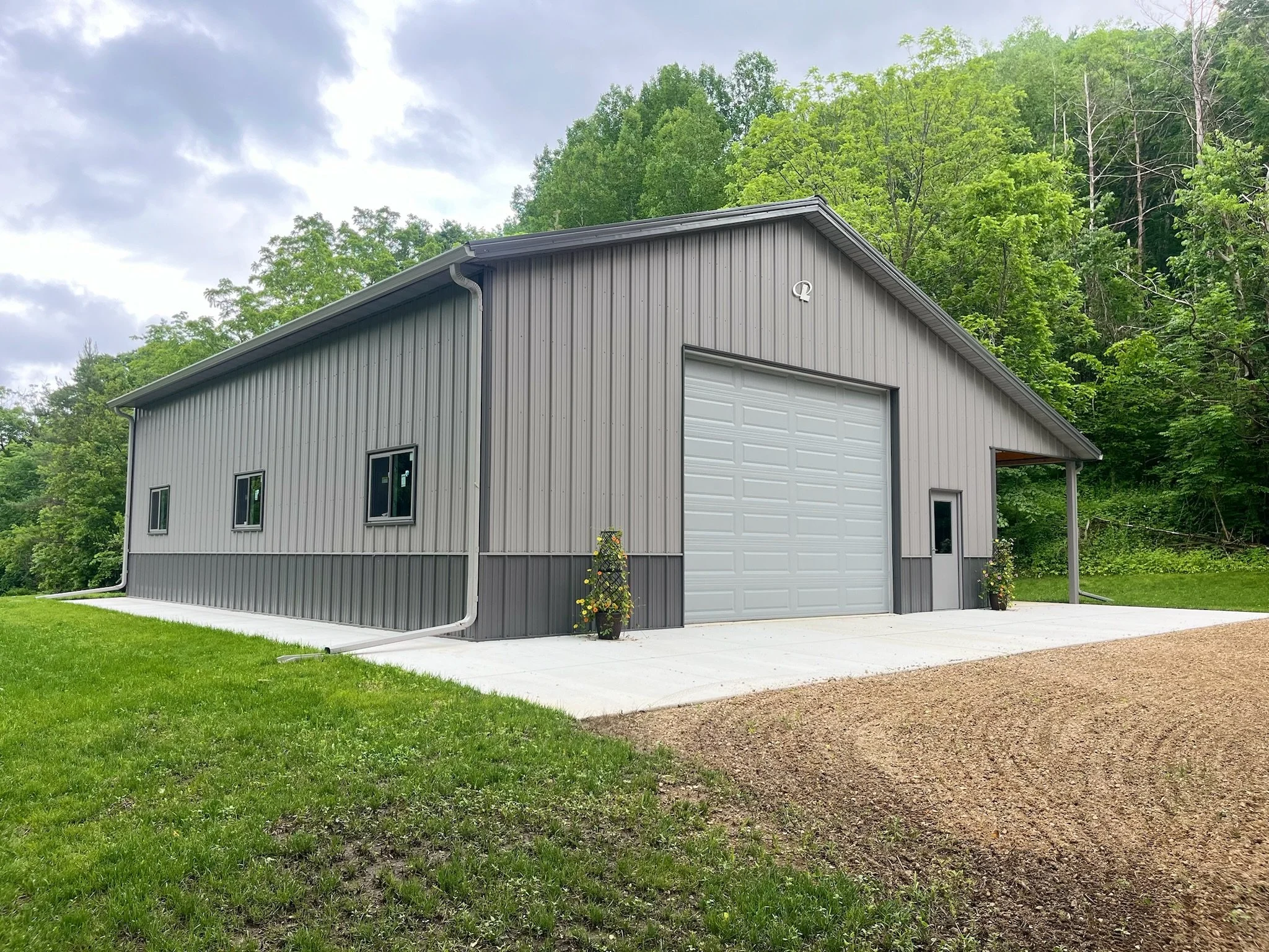 Pole barn with completed seamless gutter installation