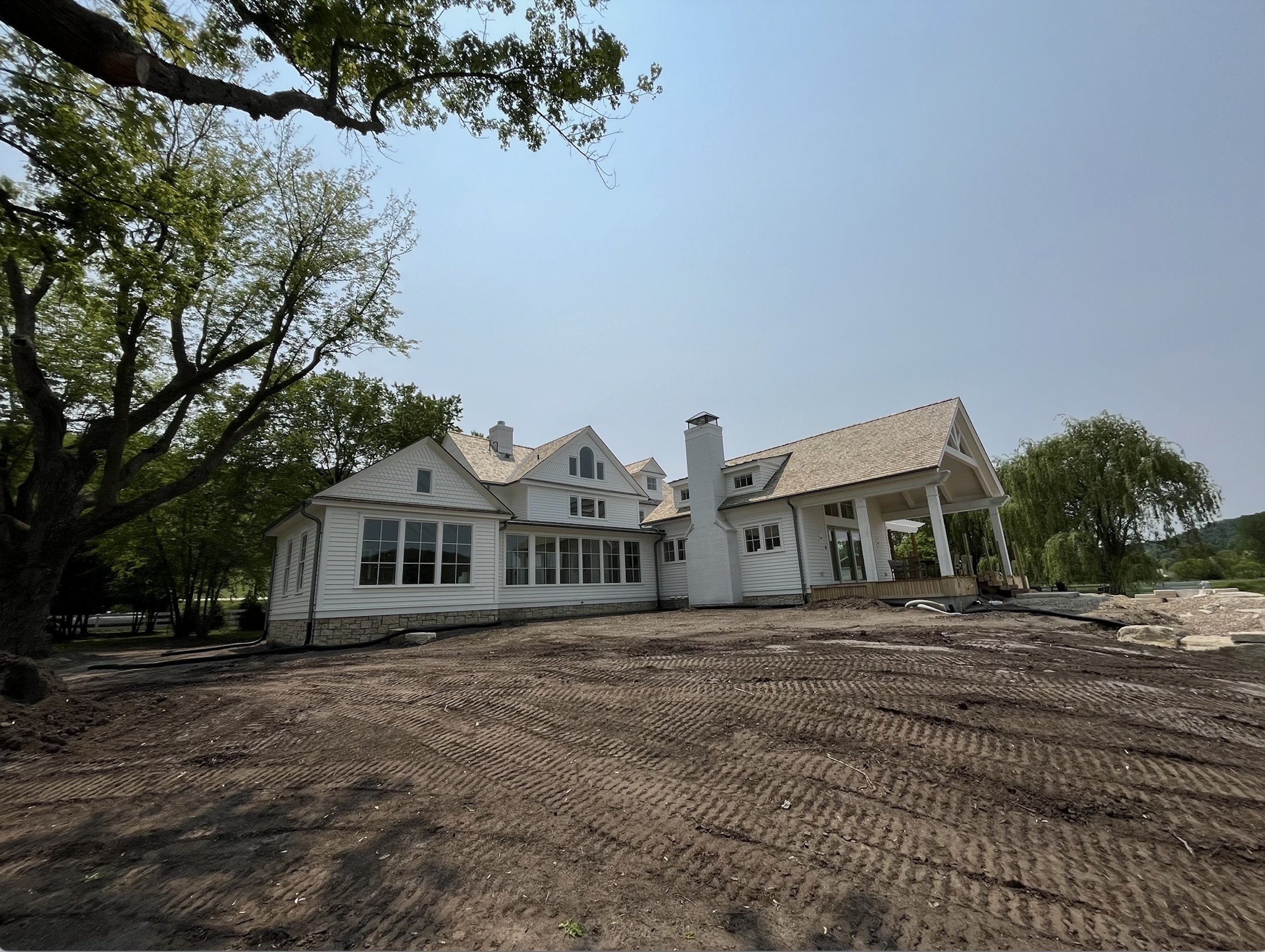 White house with newly installed seamless gutters