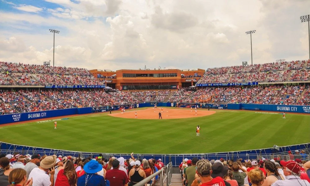 Baseball game at Oklahoma City Field with players on the field and a large crowd in the stands.