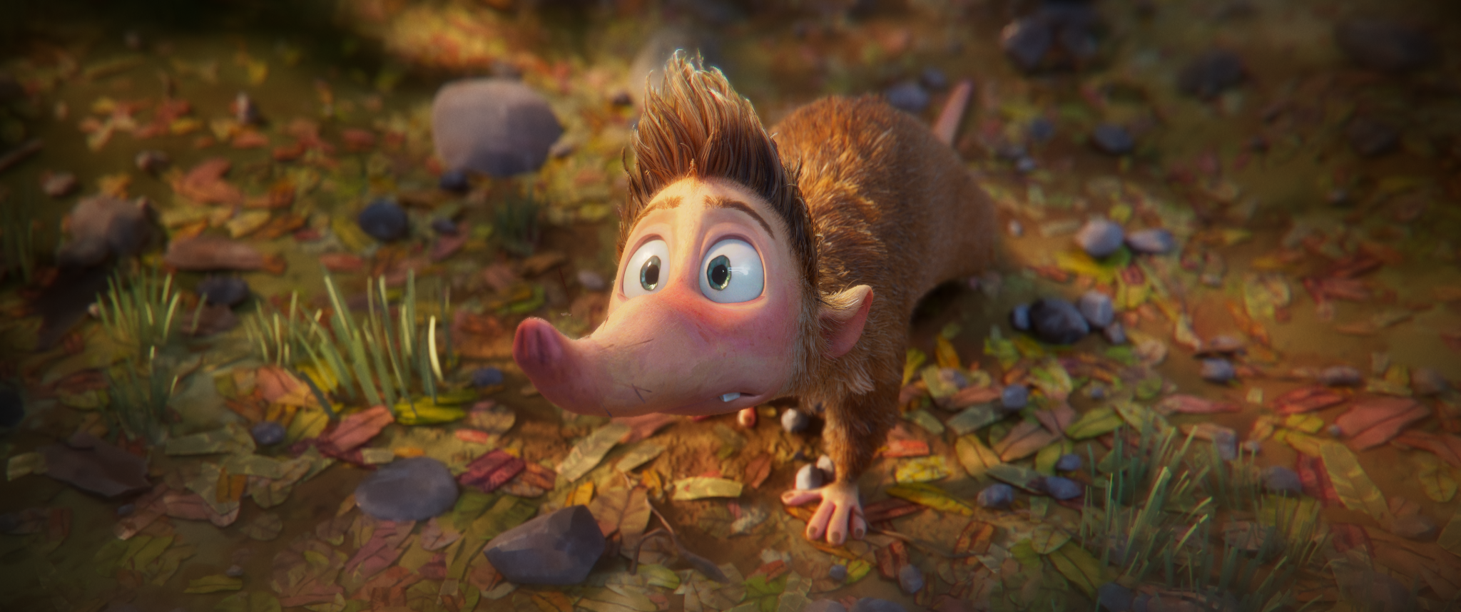 A still from an upcoming animation showing a Cuban Solenodon with a large pink snout, big expressive eyes, reddish-brown fur, on a forest floor covered with leaves, small rocks, and green grass, looking upwards with a curious or surprised expression.