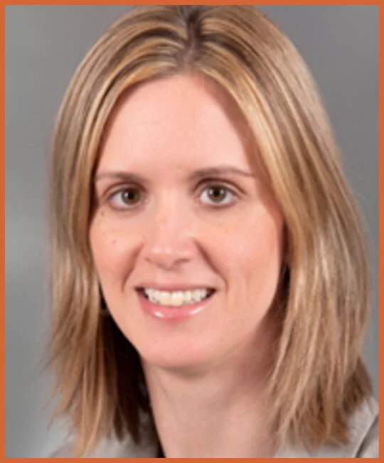 A woman with shoulder-length blonde hair smiling at the camera.