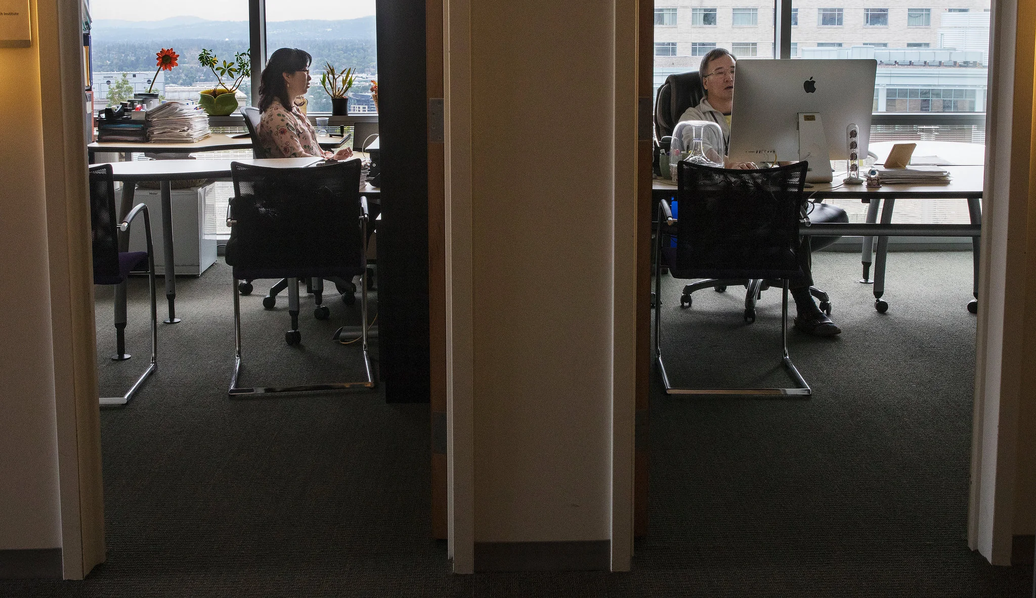 Soo-Kyung, left, and Jae, right, work next door to each other; together they are researching FOXG1 syndrome, the rare disorder Yuna has.CreditRuth Fremson/The New York Times