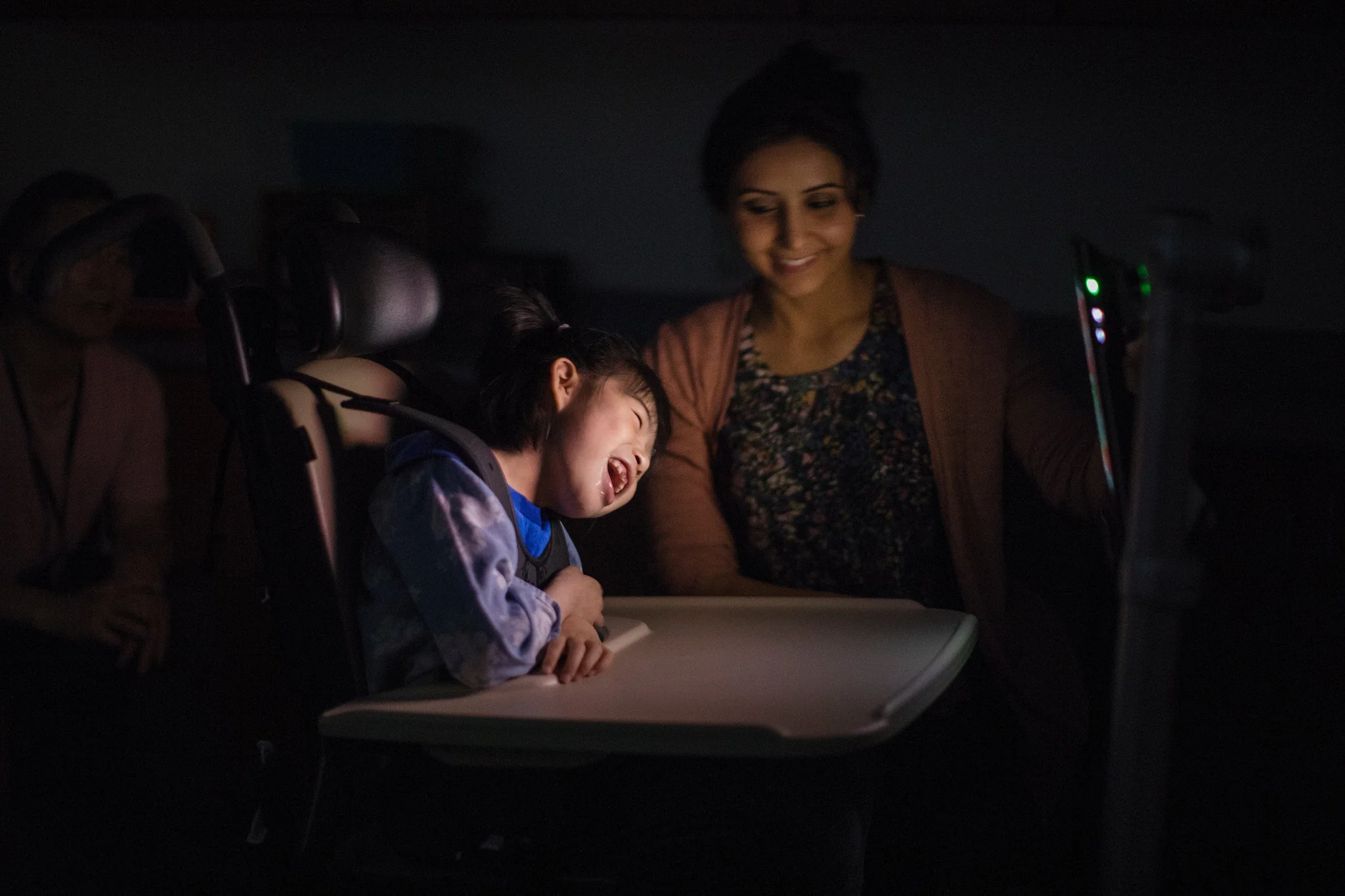 Yuna Lee with her speech therapist, Diana Deaibes at Shriners Hospital for Children in Portland, Ore. nearly a year ago. A computer program was used to teach her to communicate with her eyes by staring at something she likes onscreen. The hope is fo…