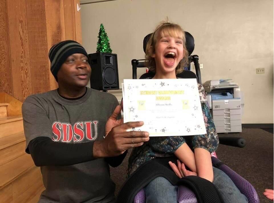 Alli wins an award at school for improvements in her communication!