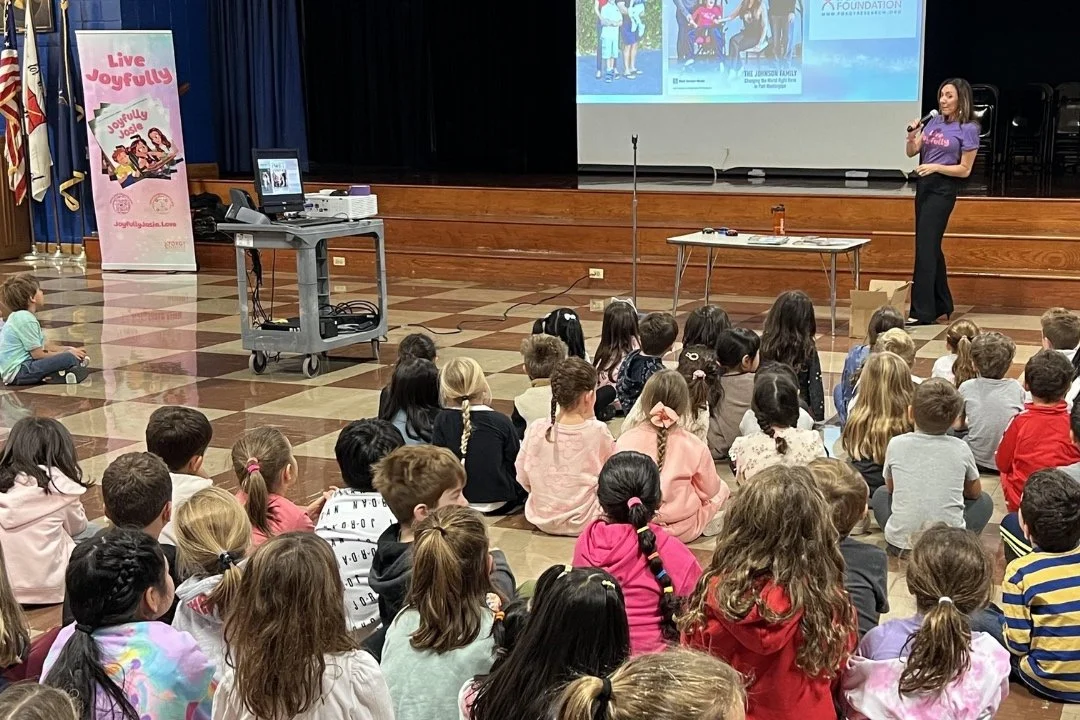 Nicole Johnson presenting Live Joyfully at a school assembly