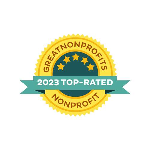 Gold and blue badge with stars, reading 'GreatNonprofits 2023 Top-Rated Nonprofit'.