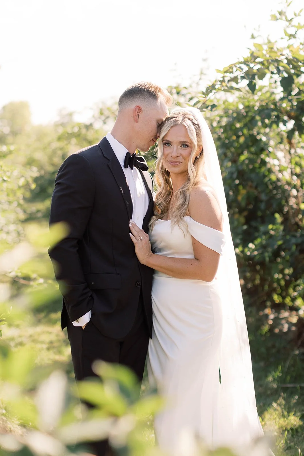 _bride and groom vineyard shot.jpg