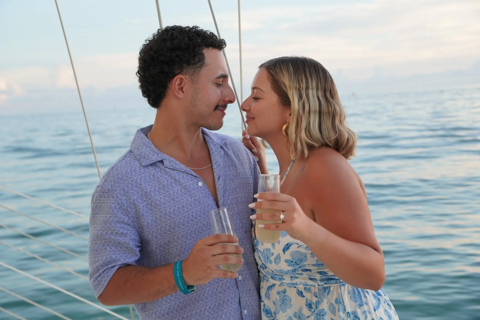 A couple enjoying champagne during a Schooner Clearwater sunset sail