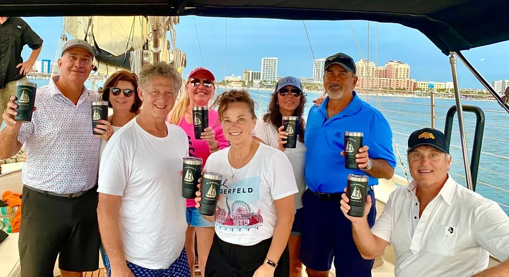 A group gets together to celebrate a company event on a private corporate sailing charter.