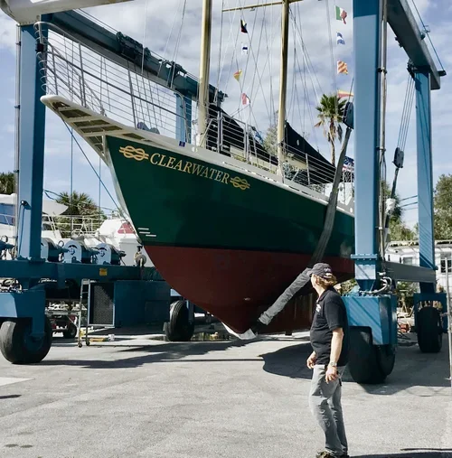 A picture of Schooner Clearwater being raised out of the water for a structural inspection.