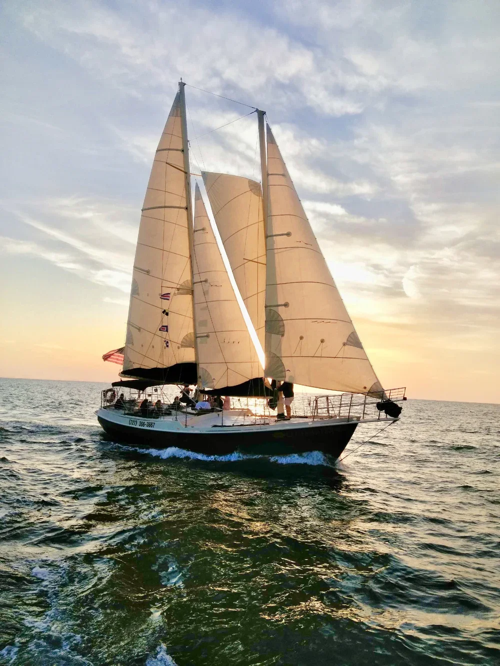 Schooner Clearwater sailing on a calm evening during sunset