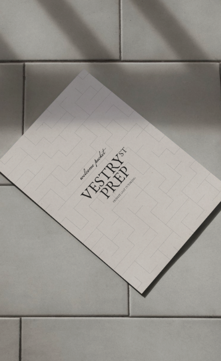 A welcome packet for a VESTRY PREP program on a tiled surface.