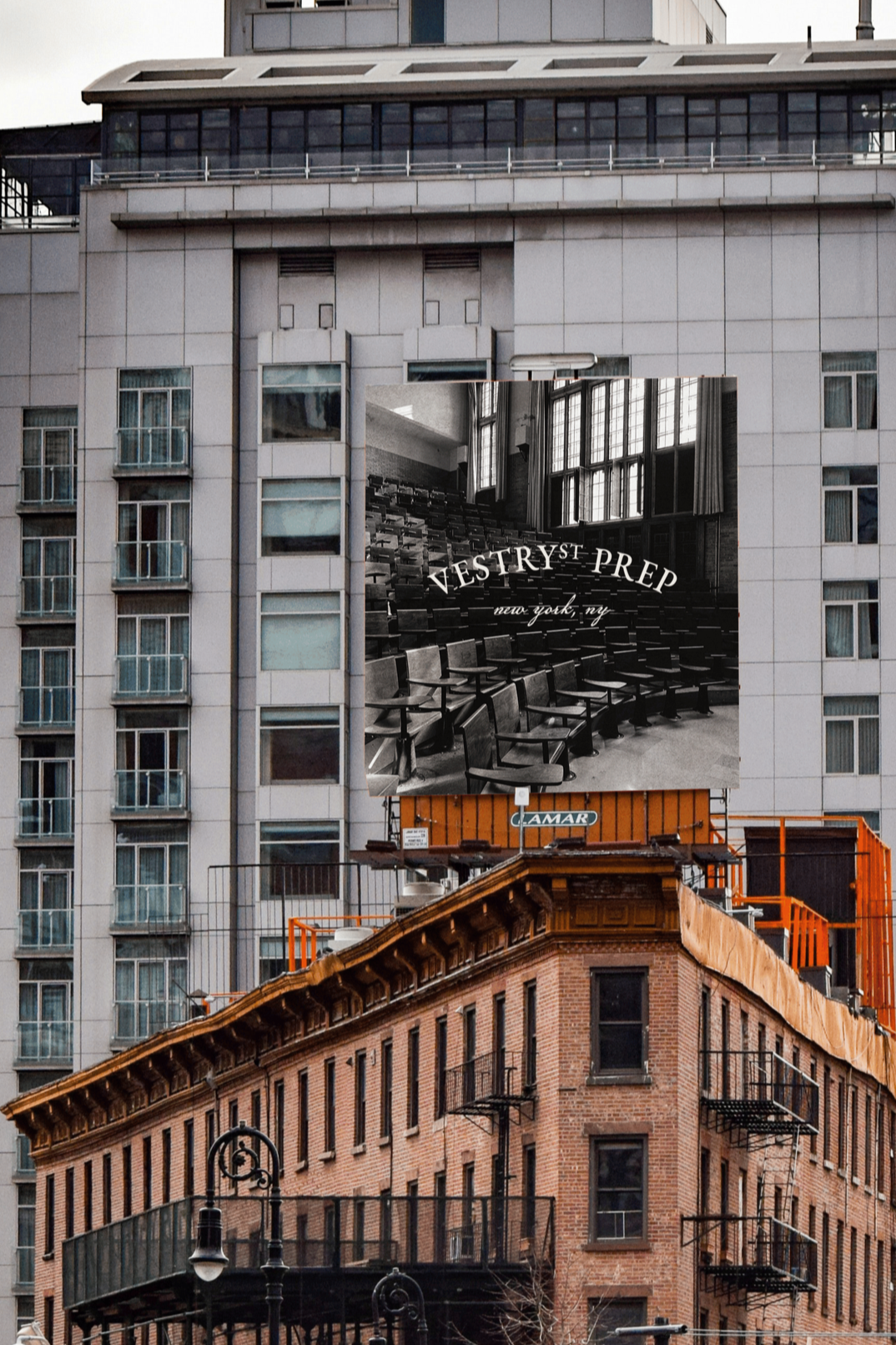 City buildings with a large billboard showing a black-and-white photo of an empty auditorium with rows of seats and large windows, advertising Vestryst Prep in New York, NY.