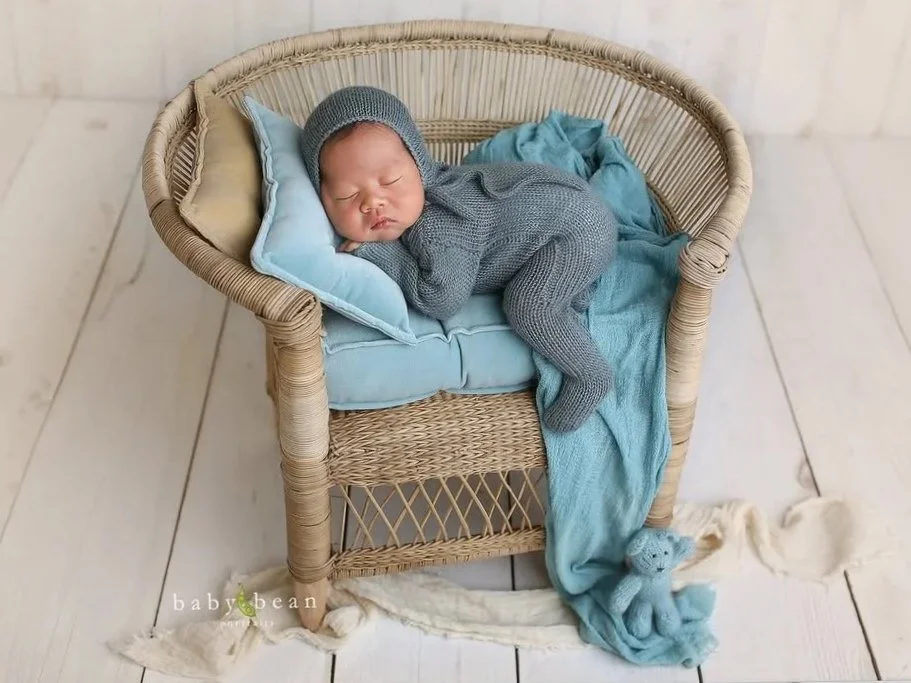 BIG+RATTAN+CHAIR+NEWBORN+BOY+AND+WHITE+CRADLE.jpg