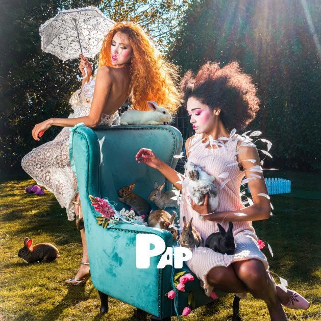 Whimsical editorial styling assistance for PAP-MAGAZINE: Models in ruffled textures in a surreal garden-themed fashion story.