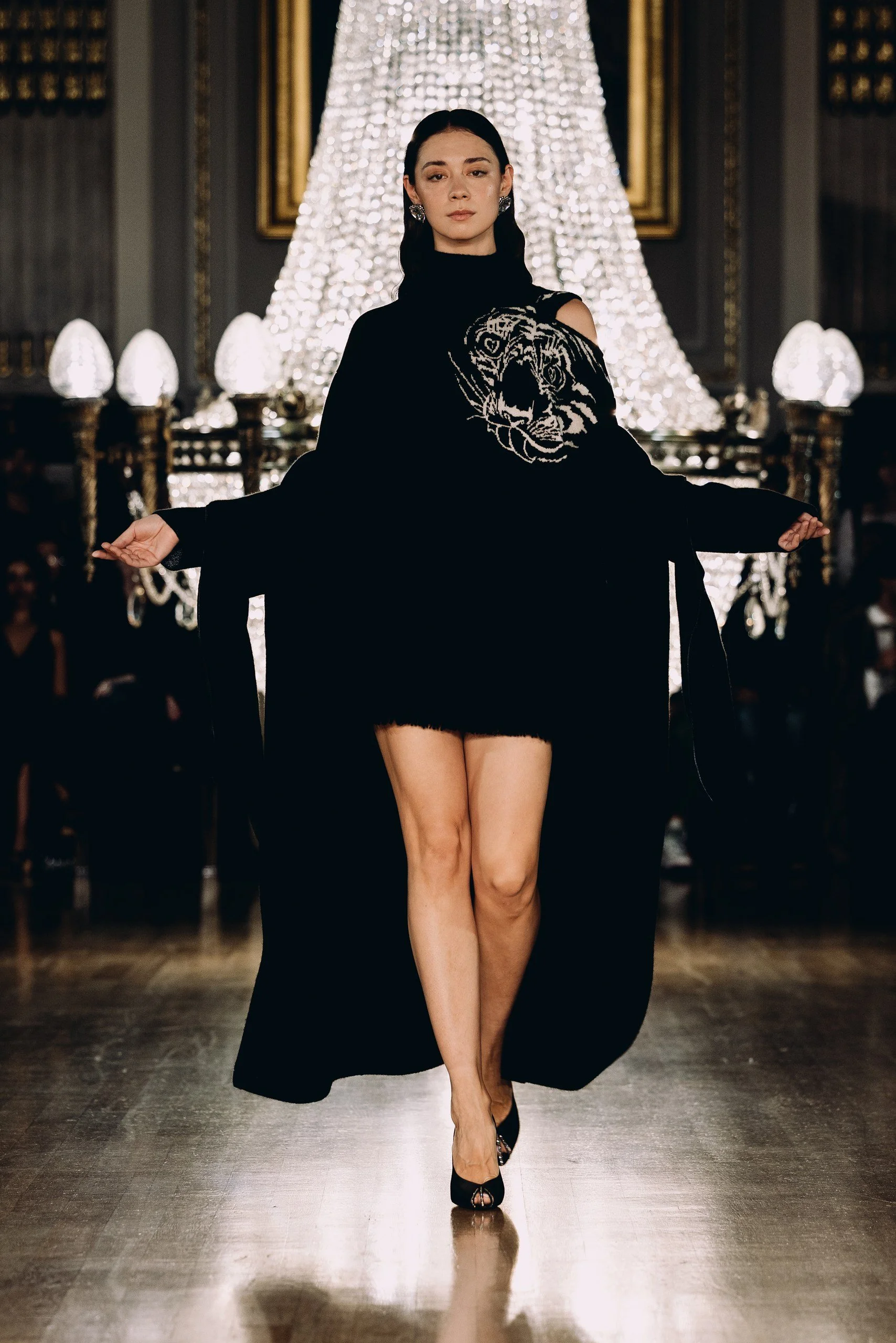 Runway presentation at London Fashion Week: Model wearing Anna Cashmere.