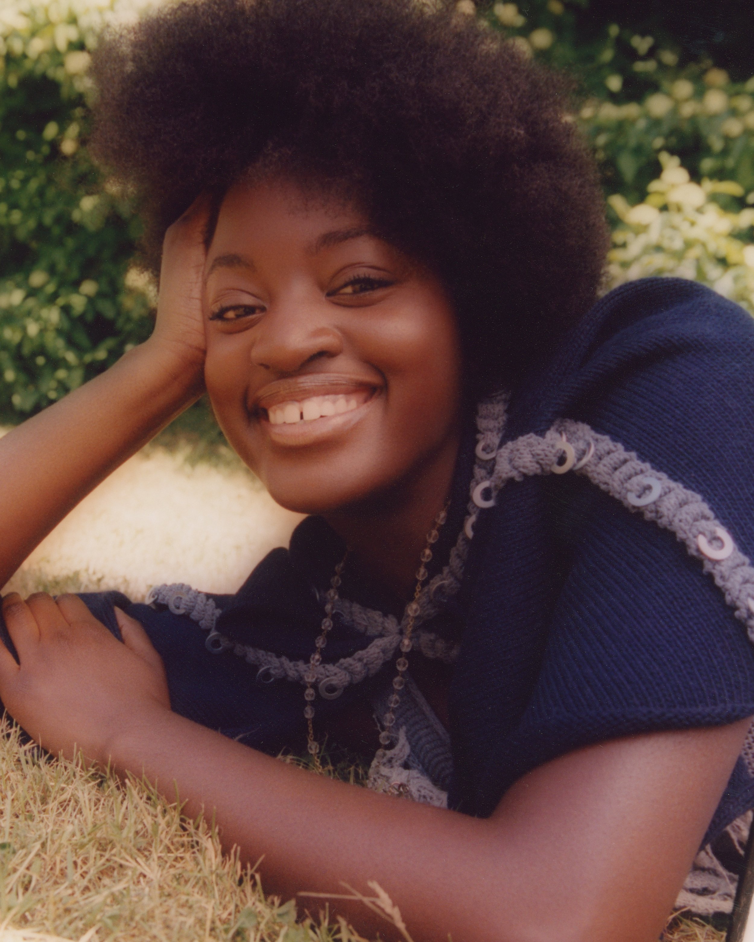 Outdoor lifestyle editorial: Detailed navy blue trim and beaded accessories, illustrating a playful, garden-inspired styling narrative.