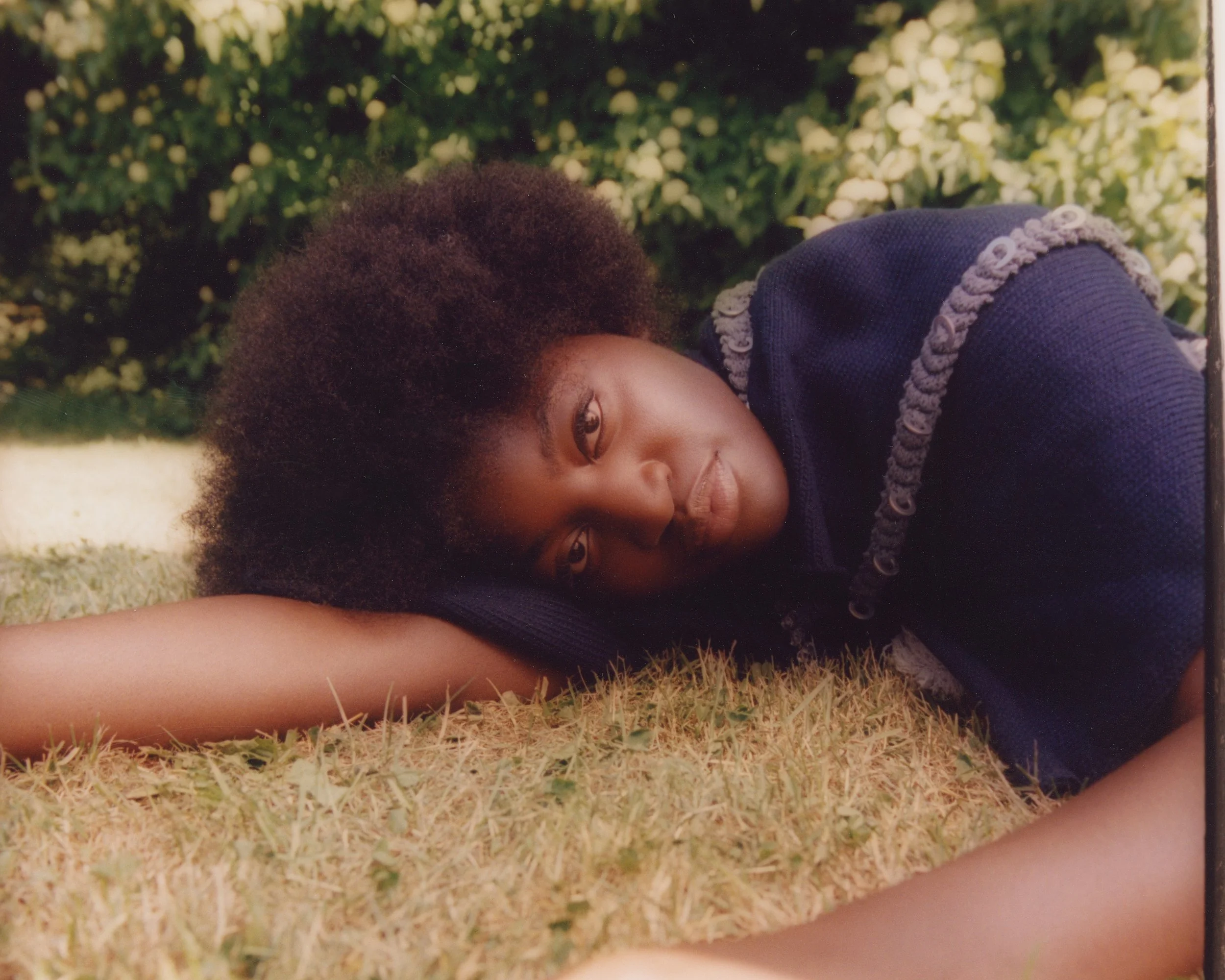Garden fashion portrait: A study in natural light and organic posing, featuring soft textures and a verdant backdrop.
