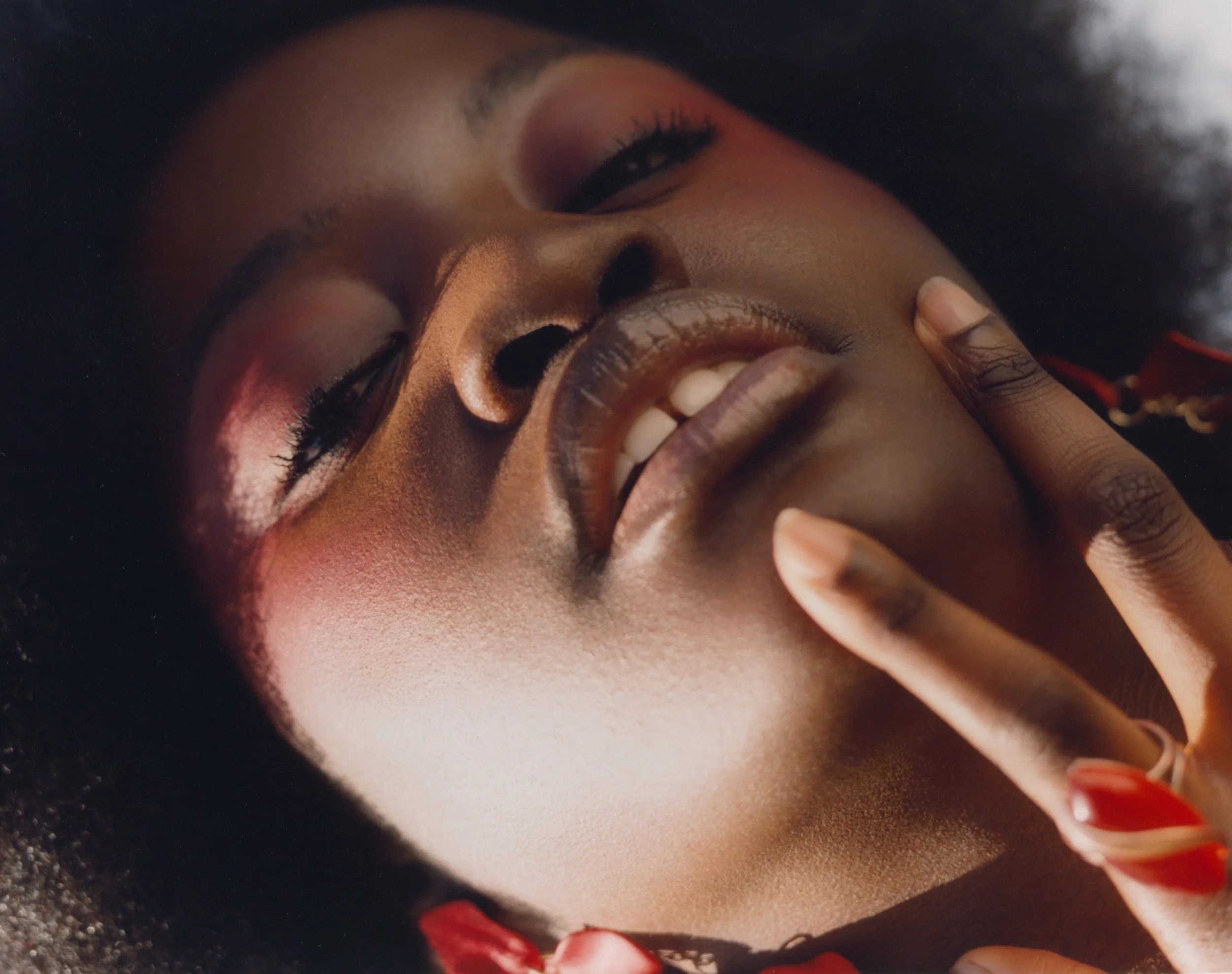 Beauty editorial: Close-up highlighting vibrant color-block makeup. 